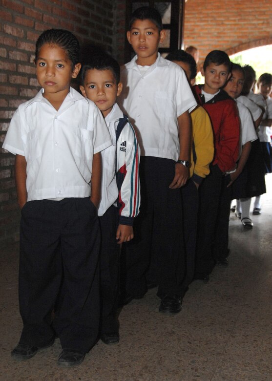 Children from Comal Huacan Village School in Comayagua, Honduras, arrive at the Lions Club in Comayagua for free dental care provided by the 808th Medical Dental Company, Fort Sheridan, Ill., in support of a dental readiness training excercice Feb. 24.  The DENTRETE is a part of Beyond the Horizon, a humanitarian assistance exercise taking place throughout Central America. (U.S. Army photo by Spc. Christopher Wellner)