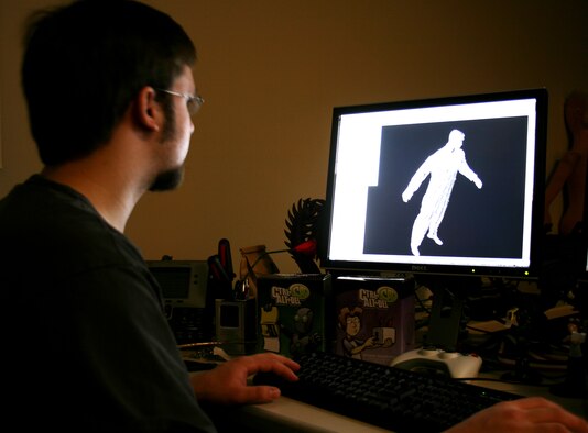 Brenton Mathews, a junior artist at Raven Software, Middleton, Wis., reviews the 3-D scan of a 115th Fighter Wing flight suit. The scan, which was taken with a laser, picks up a high degree of detail which will allow Raven Software, a subsidiary of gaming giant Activision, to have a very accurate, detailed and real graphic to utilize in current and possible future video games. (U.S. Air Force photo by Staff Sgt. Jon LaDue) 