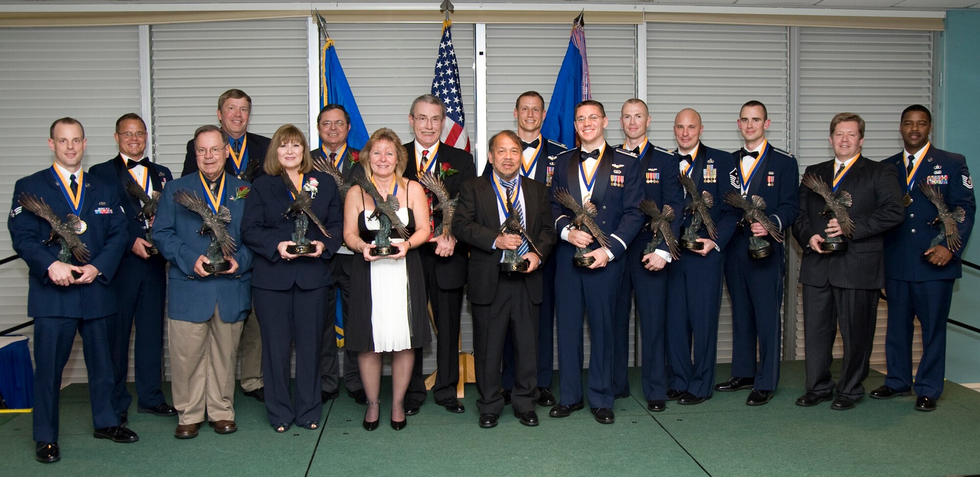 3/5/09 - the 46th Test Wing held its annual awards banquet a tthe Eglin Officers Club, Feb 18.  The winners were announced at the event.  From left to right (back row) Senior Master Sgt. Pete Buzynski(SNCO), David Crmblet (Cat. III), Bob Marshall (Tech Advisor of the Year), John Moreland (Cat IV), Maj. Darin Hoenle (FGO), Maj. Karl Seekamp (Test Aircrew of the Year), Master Sgt. Patrick Vitullo (first sergeant), 2nd Lt. Shane Rexius (Test Engineer of the Year), Darrell Decker (Analyst of the Year, 