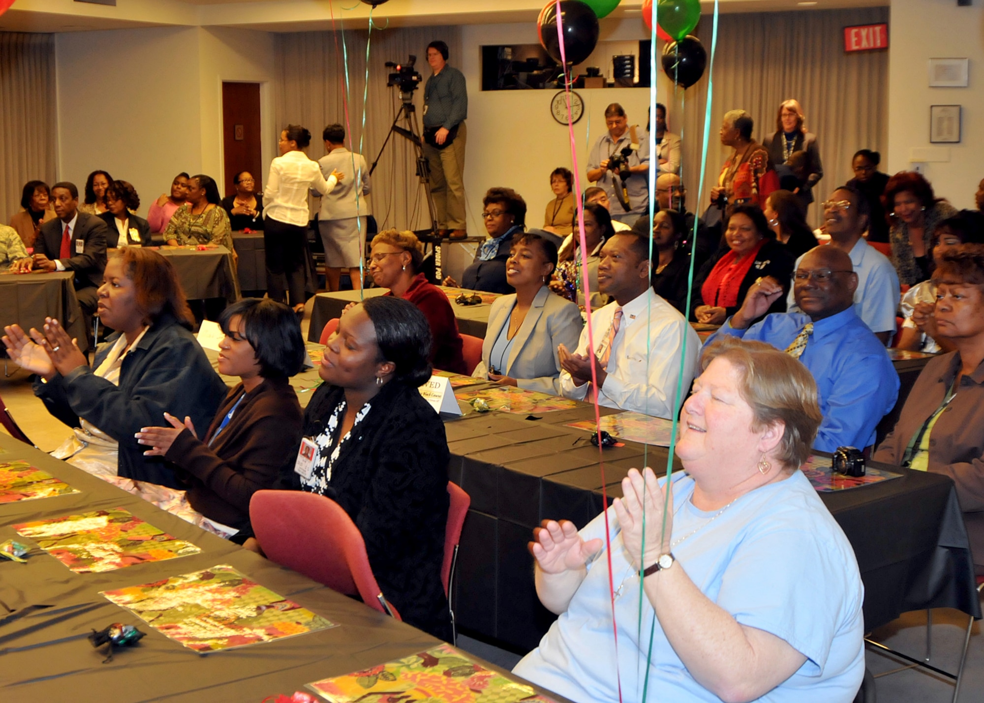 The audience responds to the comments of Dr. Terrence Roberts, a member of the Little Rock Nine, during the Black History month luncheon hosted jointly by SMC and The Aerospace Corporation, Feb. 19. Dr. Roberts spoke of his experiences as one of the nine students who attended Central High School in Little Rock, Ark. and of his perspectives on integration in the United States. (Photo by Atiba S. Copeland)