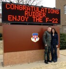 Capt. Robert M. Burgon, the first Vance T-38 First Assignment Instructor Pilot to receive an F-22 assignment, and his girlfriend, XXXXXXXXXXXX, pose in front of the base operations marquee. Ms. XXXXXXXX was on hand to hose down Captain Burgon after his fini-flight March 3 in a 25th Flying Training Squadron T-38. He is heading for Tyndall AFB, Fla., for training to fly the F-22 Raptor. Captain Burgon is a graduate of Vance’s class 05-13 and served as a T-38 FAIP here from January 2006 to September 2008. (U.S. Air Force photo by Terry Wasson)