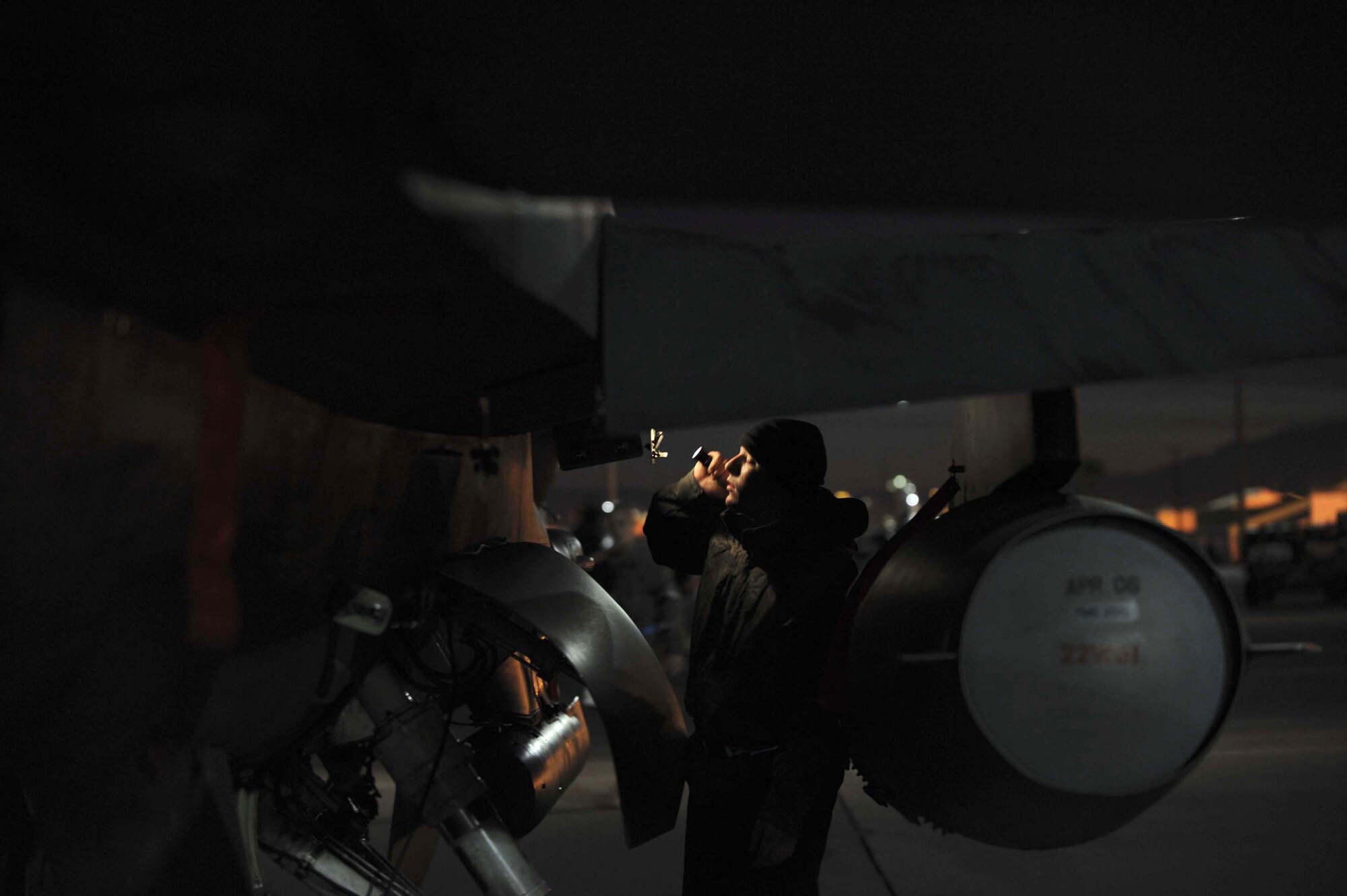 Airman 1st Class Patrick Densford conducts a walk-through inspection of an F-16 Fighting Falcon before night flying operations during Red Flag 09-3 Feb. 26 at Nellis Air Force Base, Nev. Red Flag is a multinational exercise providing a realistic environment to practice combat scenarios. Airman Densford is a 52nd Aircraft Maintenance Squadron F-16 crew chief deployed from Spangdahlem Air Base, Germany. (U.S. Air Force photo/Senior Airman Larry E. Reid Jr.) 
