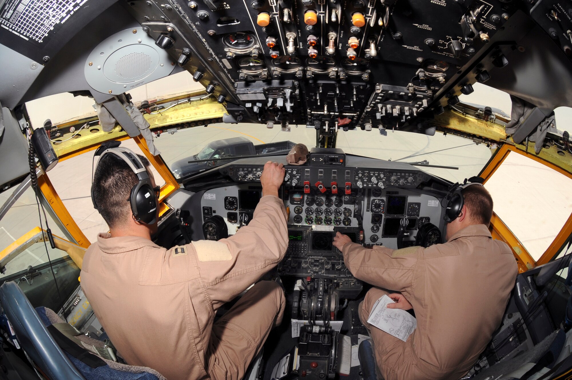 Captain Andrew McLay, and 1st Lieutenant Clint Waitkus both pilots with the 340th Expeditionary Air Refueling Squadron, run through their preflight checklists prior to take off in a KC-135R Stratotanker, March 5, 2009, in an undisclosed location in Southwest Asia.  The preflight checks ensure all systems are operating properly before takeoff.  Captain McLay is native to Evergreen Colo. and Lieutenant Waitkus hails from Tucson, Ariz. both are deployed from Royal Air Force, Mildenhall, England in support of Operations Iraqi and Enduring Freedom and Combined Joint Task Force - Horn of Africa. (U.S. Air Force Photo by Staff Sgt. Joshua Garcia/released)
