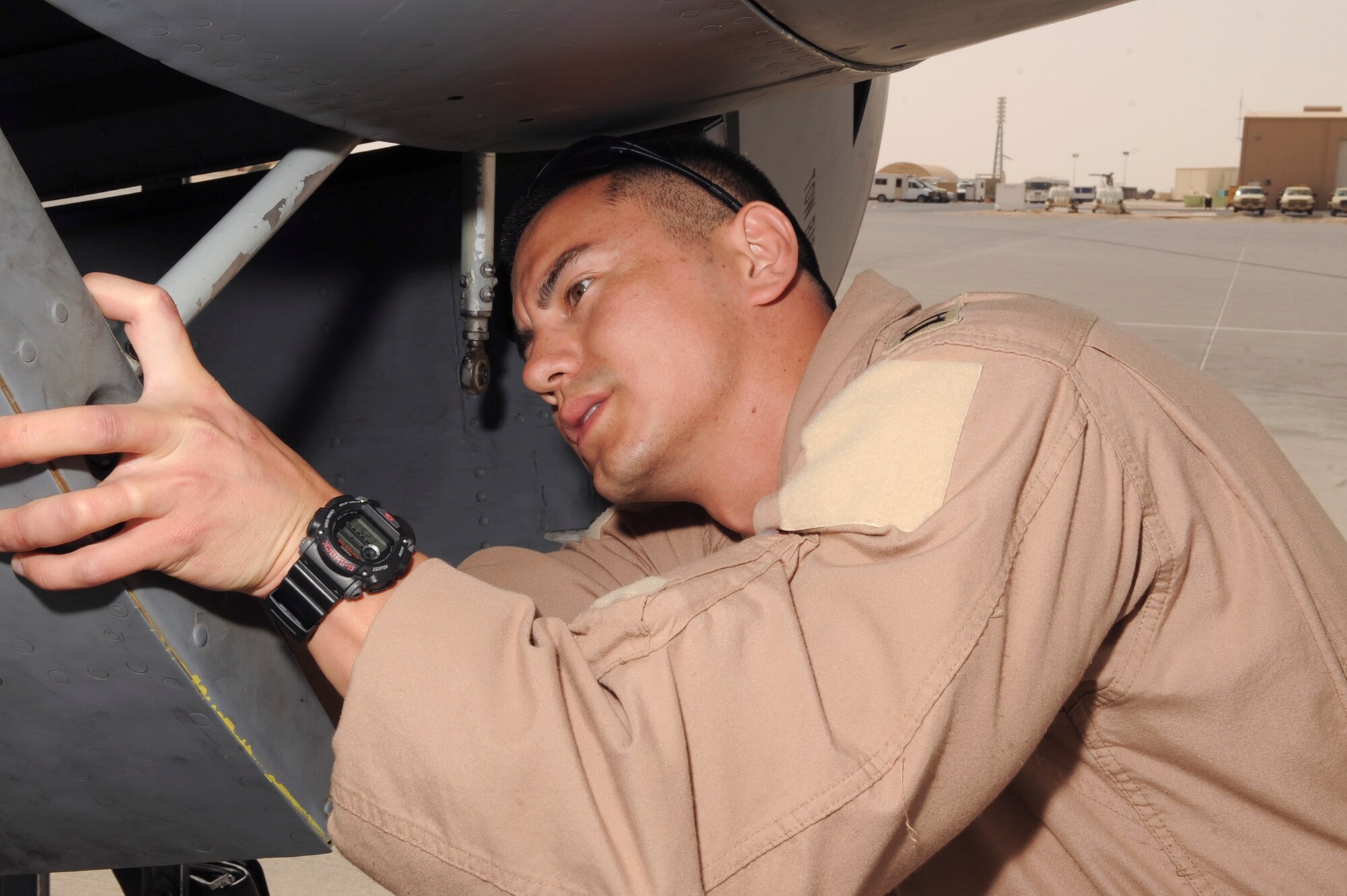 Captain Andrew McLay, a pilot with the 340th Expeditionary Air Refueling Squadron, does a walk-around to check out the overall exterior of a KC-135R Stratotanker prior to boarding the aircraft for preflight checks, March 5, 2009, in an undisclosed location in Southwest Asia.  Captain McLay is native to Evergreen Colo. and is deployed from Royal Air Force, Mildenhall, England in support of Operations Iraqi and Enduring Freedom and Combined Joint Task Force - Horn of Africa.  (U.S. Air Force Photo by Staff Sgt. Joshua Garcia/released)