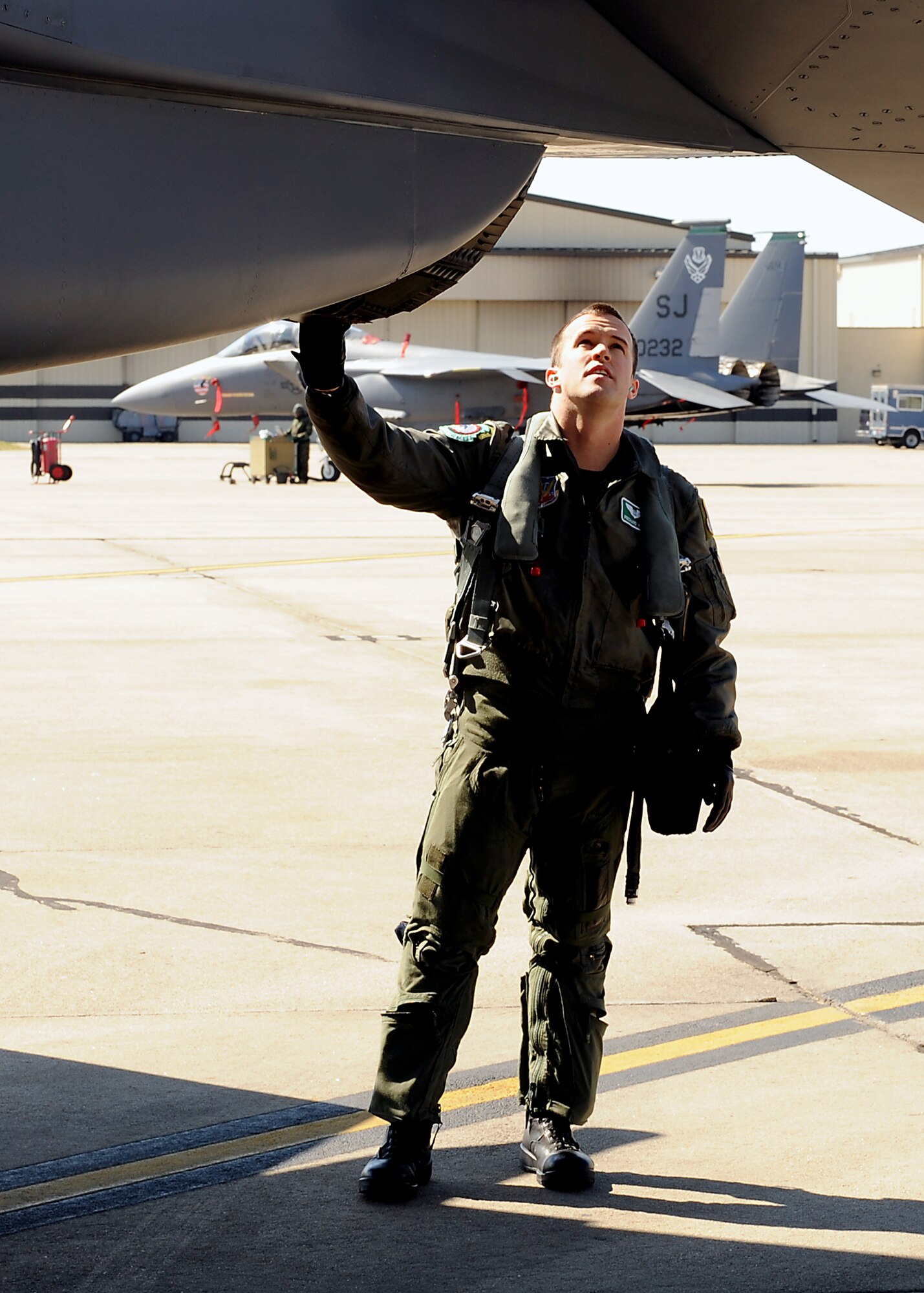 Captain Prichard Keely, 335th Fighter Squadron weapons systems officer, checks over his F-15E Strike Eagle before he takes off from Seymour Johnson Air Force Base, N.C., Feb. 23, 2009. In April 2008, Captain Keely and aircrew from the 335th FS provided close-air support for ground forces during a massive firefight in Shok Valley, Afghanistan. The 335th FS was deployed in support of Operation Enduring Freedom. (U.S. Air Force Photo by Airman 1st Class Gino Reyes)