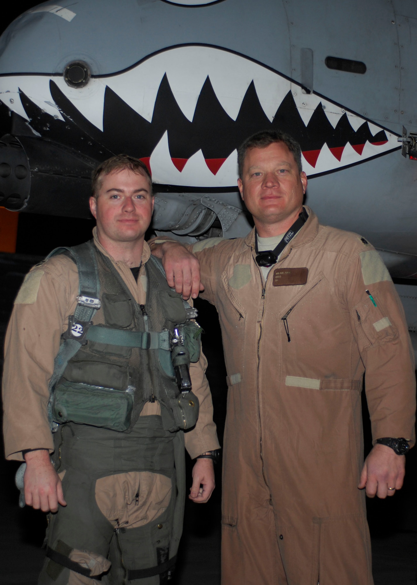 Capt. Bob "Grim" Burdette, 75th Expeditionary Fighter Squadron, and Lt. Col. Sam "Spam" Milam, 75th EFS commander, complete a mission, Bagram Air Field, Afghanistan, Feb. 28 that gave Colonel Milam more than 3,000 combat flight hours. "I am very happy, it was a lot of hard work and its a great thing. Many man hours go into each flight and its a great accomplishment." He also thanked the crew chiefs because without them, they would not be able to do their mission. Both pilots are deployed from Moody Air Force Base, Ga. (U.S. Air Force photo/ Senior Airman Erik Cardenas)(Released)