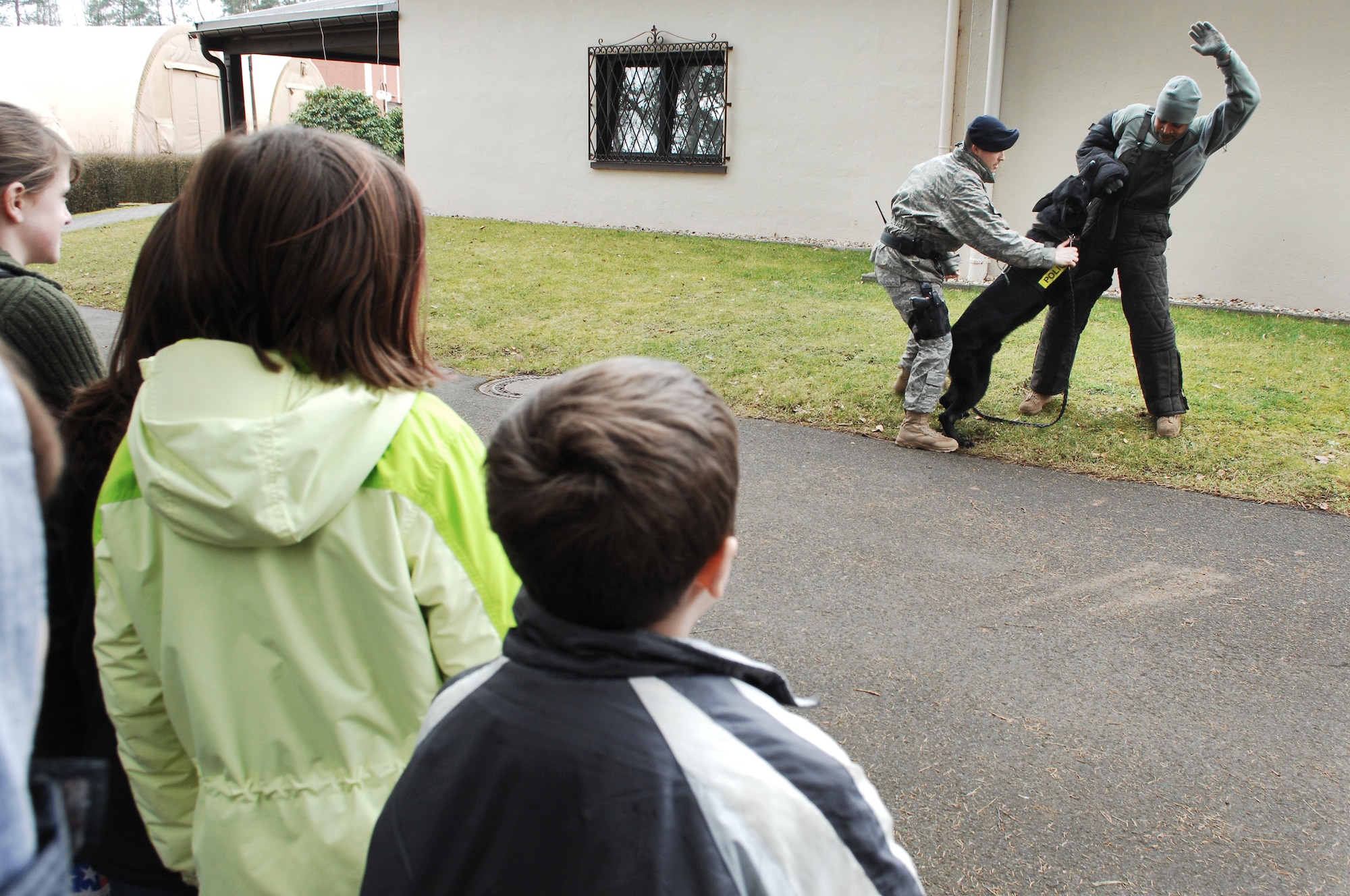The 435th Security Forces Squadron K-9 unit does a demonstration for children during the Kids 4 Kids monthly event Feb. 27, 2009, at Ramstein Air Base. K4K is a monthly program for children with a deployed parent with events designed to help children understand better what their parent's do while deployed. (U.S. Air Force photo by Senior Airman Amber Bressler)