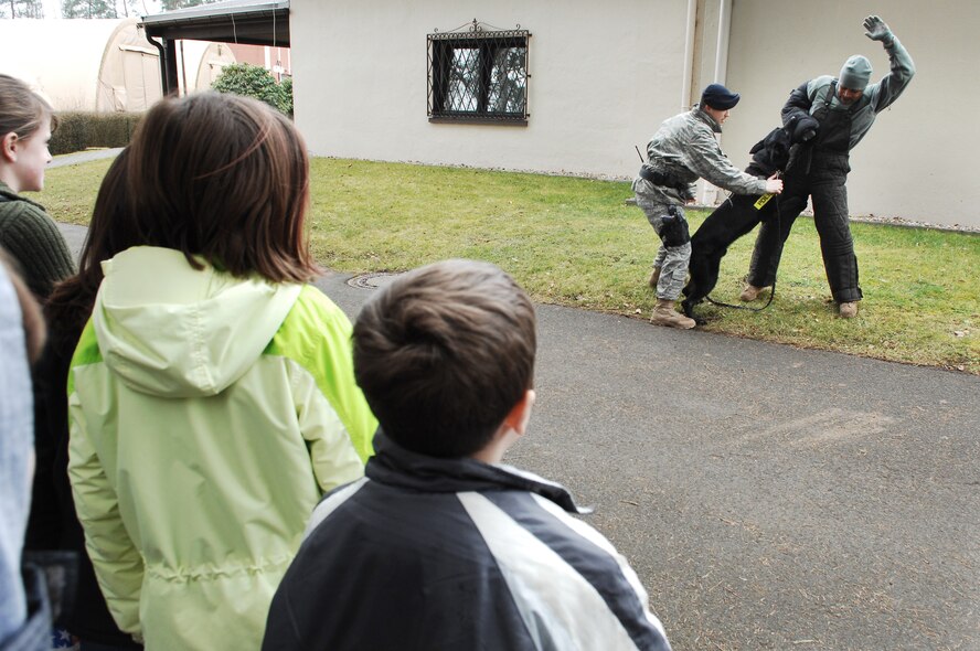 The 435th Security Forces Squadron K-9 unit does a demonstration for children during the Kids 4 Kids monthly event Feb. 27, 2009, at Ramstein Air Base. K4K is a monthly program for children with a deployed parent with events designed to help children understand better what their parent's do while deployed. (U.S. Air Force photo by Senior Airman Amber Bressler)