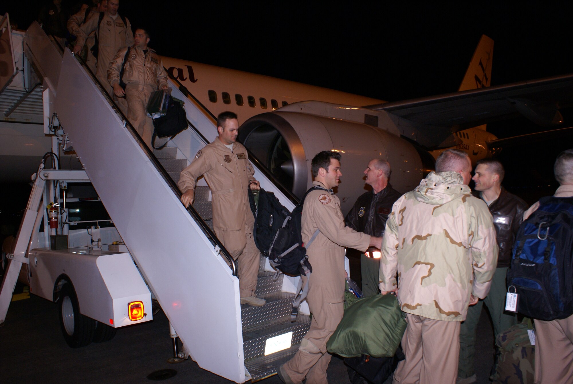 MCCHORD AIR FORCE BASE, Wash. -- Airmen of the 8th Airlift Squadron are welcomed home by Col. Jeffrey Stephenson, 62nd Airlift Wing commander, and Col. Michael Hornitschek, 62nd AW vice commander, March 5. The Airmen just completed a 120-day deployment in support of Operations Enduring Freedom and Iraqi Freedom. (U.S. Air Force photo/Tech. Sgt. Oshawn Jefferson)