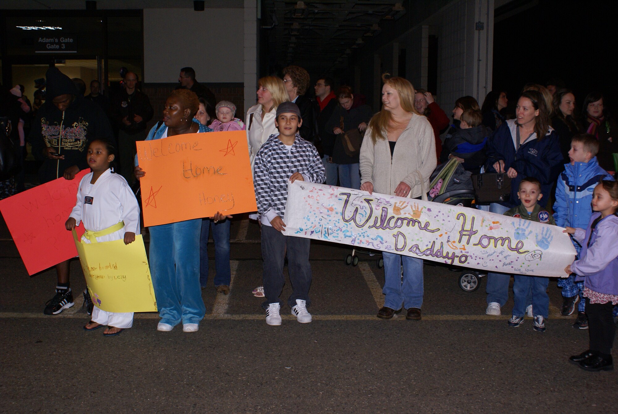 MCCHORD AIR FORCE BASE, Wash. -- Family members and friends wait on the flightline March 5 to greet more than 120 8th Airlift Squadron Airmen. The Airmen just returned from a a 120-day deployment in support of Operations Enduring Freedom and Iraqi Freedom. (U.S. Air Force photo/Tech. Sgt. Oshawn Jefferson)