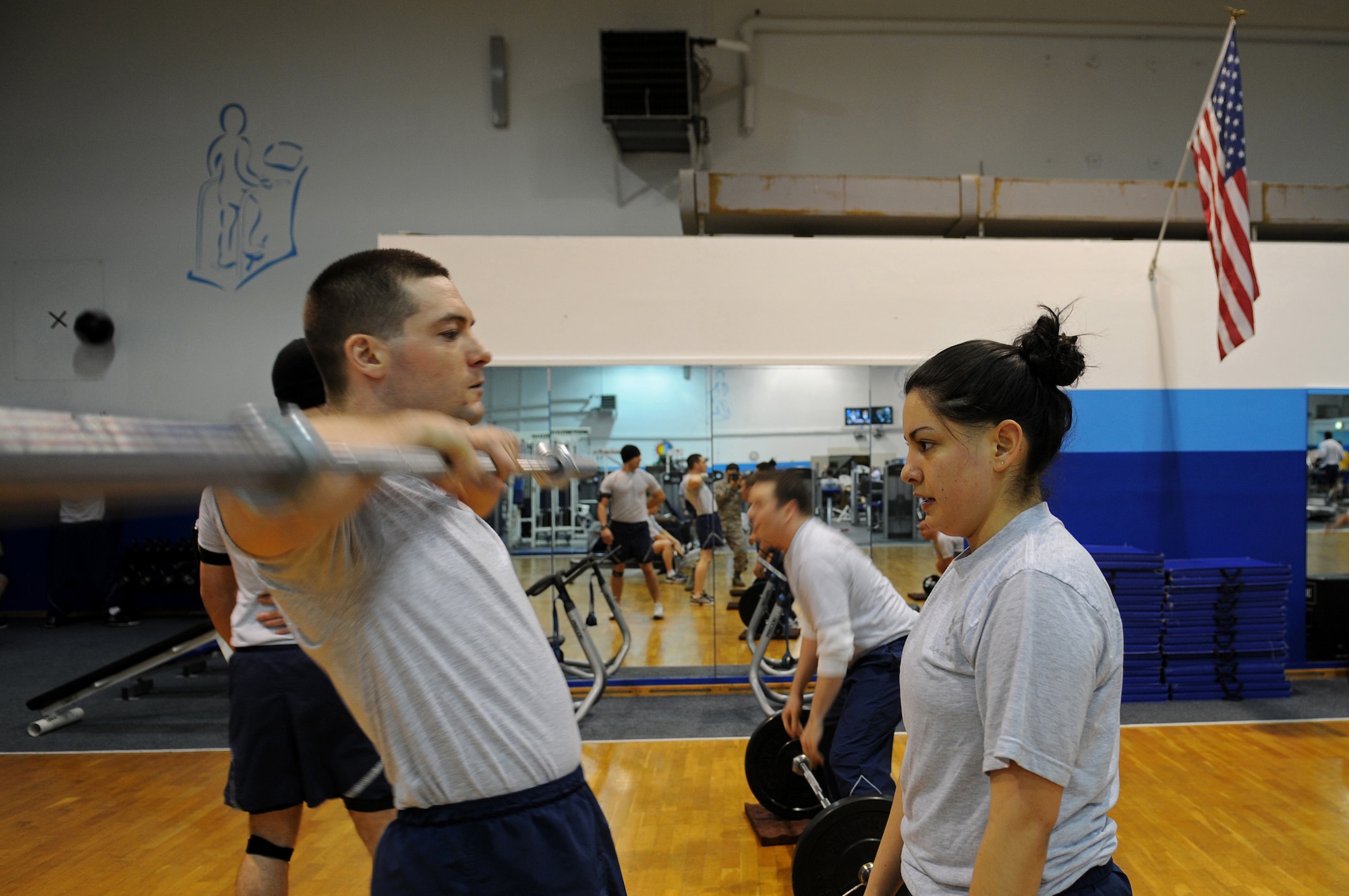 Airmen of the 1st Combat Communications Squadron work out using the Total Fitness program as part of their physical training Feb. 27, 2009, at Ramstein Air Base. The 1st Combat Communications Squadron has increased their overall squadron PT score by six points. (U.S. Air Force photo by Airman 1st Class Grovert Fuentes-Contreras)