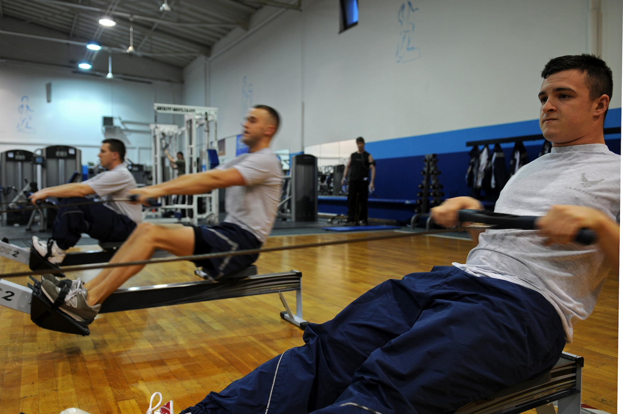 Airmen of the 1st Combat Communications Squadron work out using the Total Fitness program as part of their physical training Feb. 27, 2009, at Ramstein Air Base. The 1st Combat Communications Squadron has increased their overall squadron PT score by six points. (U.S. Air Force photo by Airman 1st Class Grovert Fuentes-Contreras)