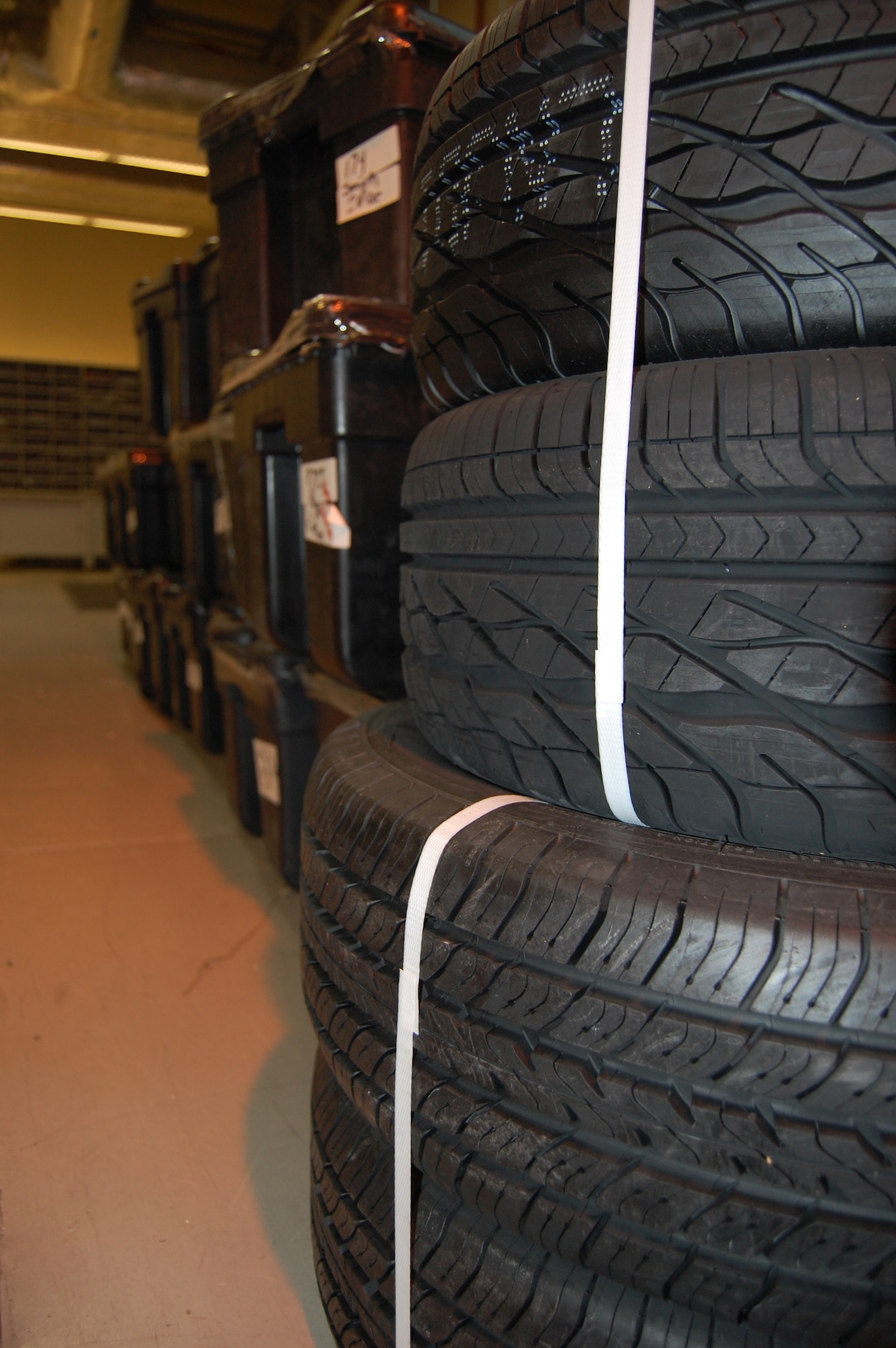 Stacks of tires and trunks rest in the Aviano Post Office March 3. These are just some of the many types of items post office staff members handle in an average week for it's more than 7,000 base customers.  (U.S. Air Force photo/Staff Sgt. Lindsey Maurice)