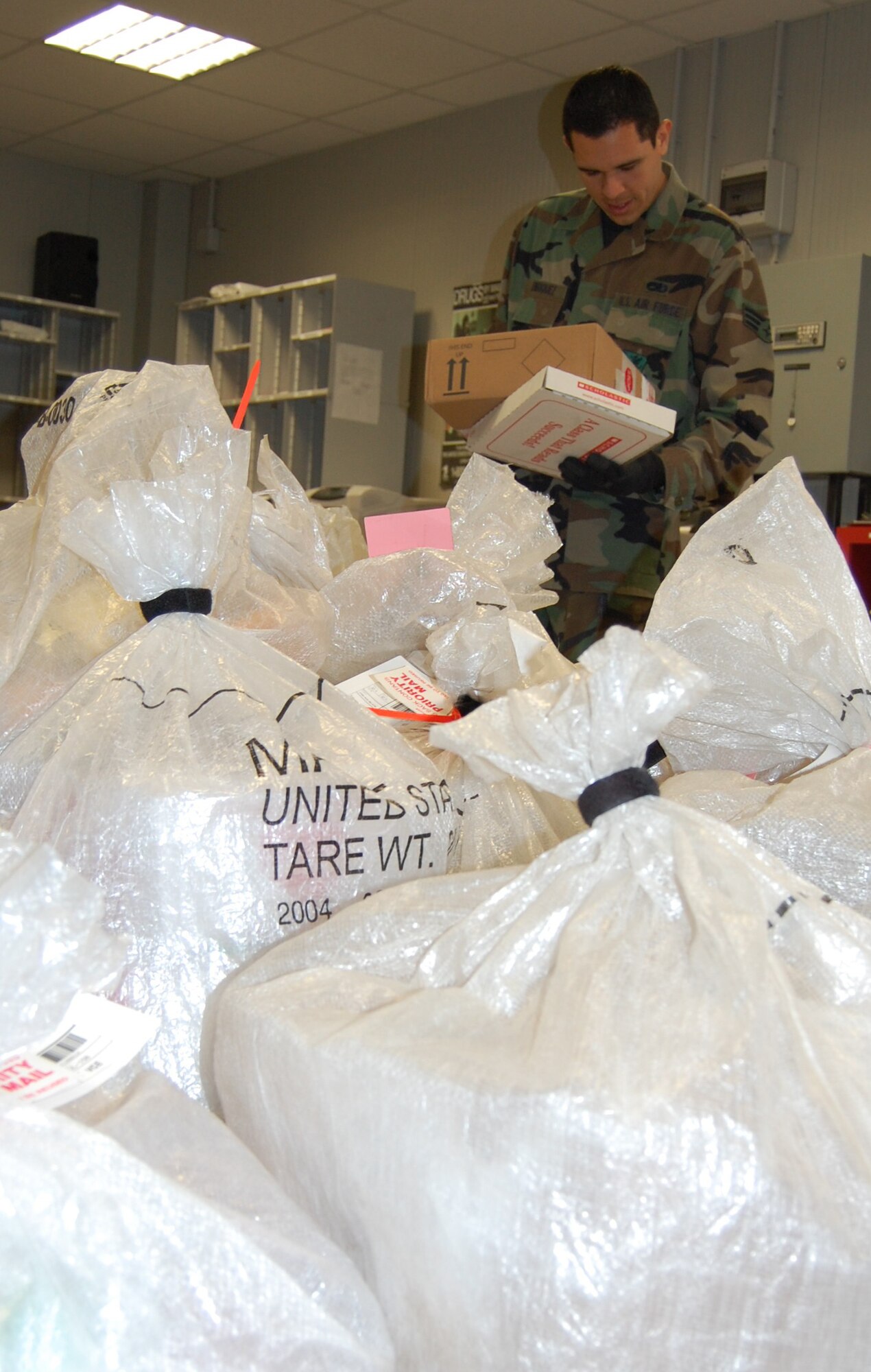 Senior Airman Francisco Enriquez of the Aviano Post Office sorts organizational mail in the official mail postal annex March 3. The base post office was recently named the Best Large APO in the U.S. Air Forces Europe. (U.S. Air Force photo/Staff Sgt. Lindsey Maurice)