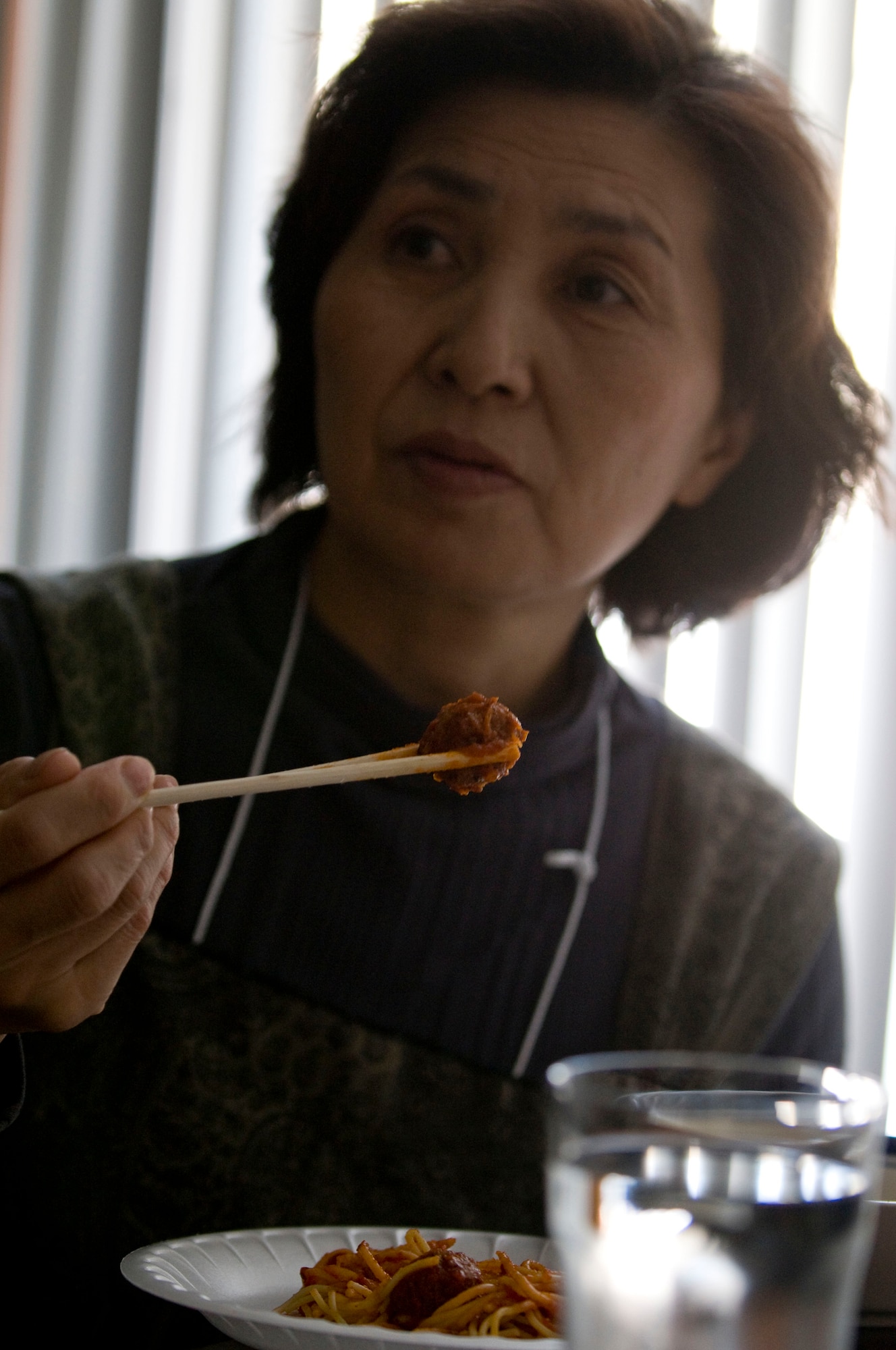 MISAWA AIR BASE, Japan -- Mitsue Sato tries spaghetti with meatballs March 4, 2009. After eating her first portion, Ms. Sato asked for seconds. She was among more than 80 women of the Tohoku Health and Diet Improvement Program who visited American homes as part of a cultural exchange. (U.S. Air Force photo by Staff Sgt. Samuel Morse)