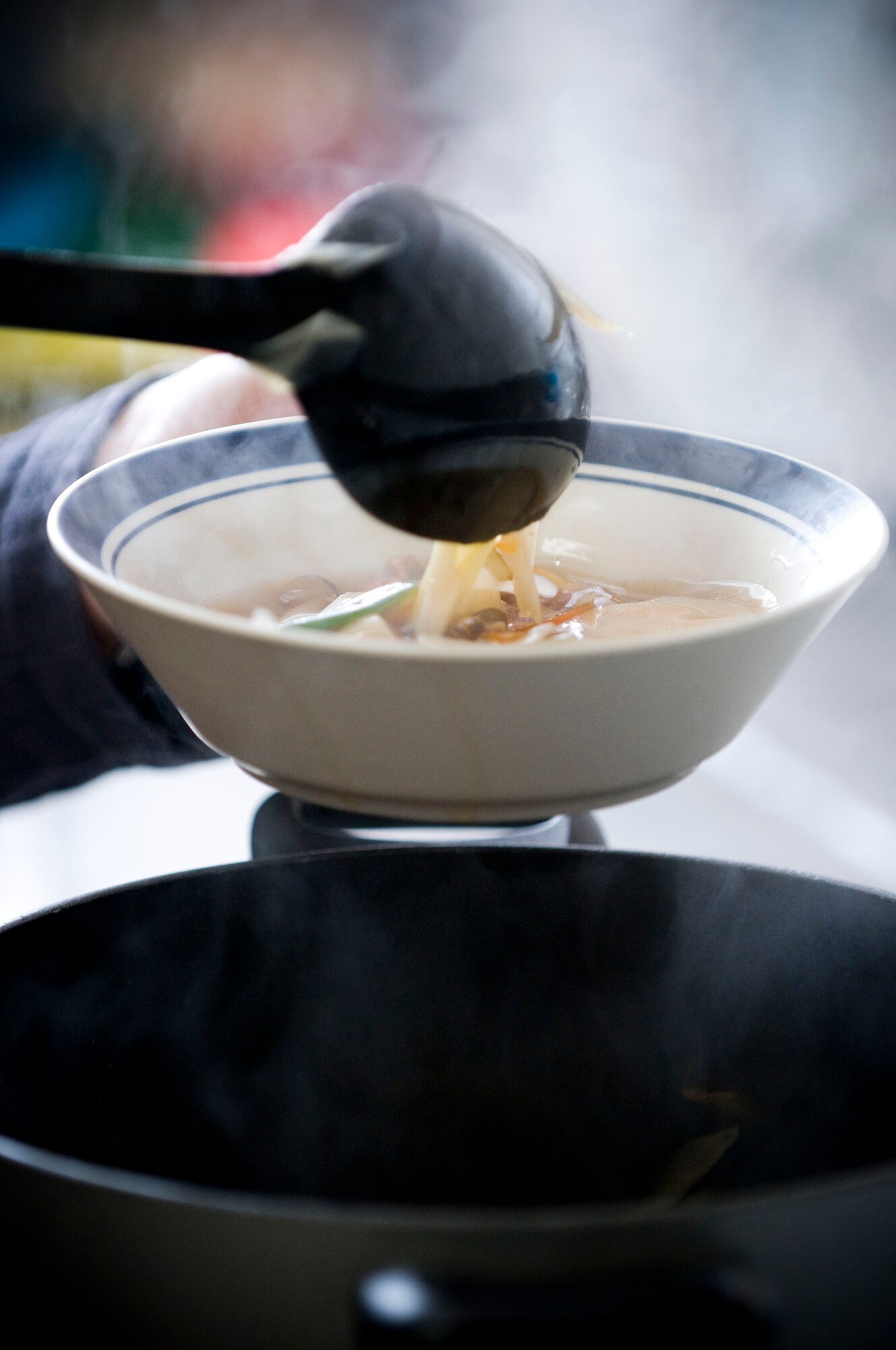 MISAWA AIR BASE, Japan -- Steam rises from fresh Japanese vegetable dumpling soup March 4, 2009. American families were paired with Japanese representatives from the Tohoku Health and Diet Improvement Program to share their culinary expertise. (U.S. Air Force photo by Staff Sgt. Samuel Morse)