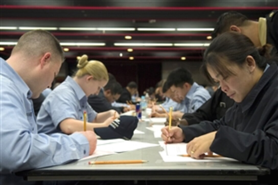 U.S. Navy Sailors from various commands at Fleet Activities Yokosuka, Japan, begin the Navy-wide E-6 advancement exam March 5, 2009. Participants are given three hours to complete the 200-question test.