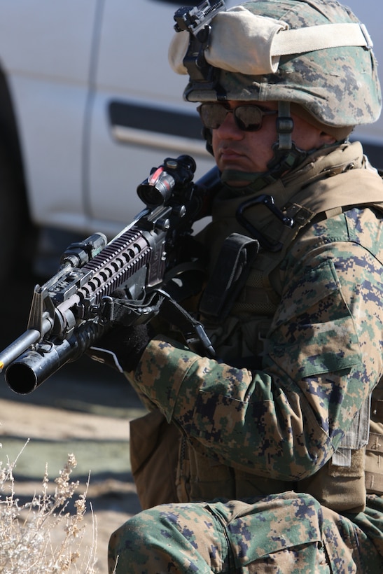 Lance Cpl. Nathan Rojas, a rifleman with Weapons Company, 3rd Battalion, 4th Marine Regiment, sets up security while fellow Marines search the area for notional enemy activity during a convoy training exercise stretching from Bridgeport, Calif., to Hawthorne Army Ammunition Depot in Hawthorne, Nev., March 7.