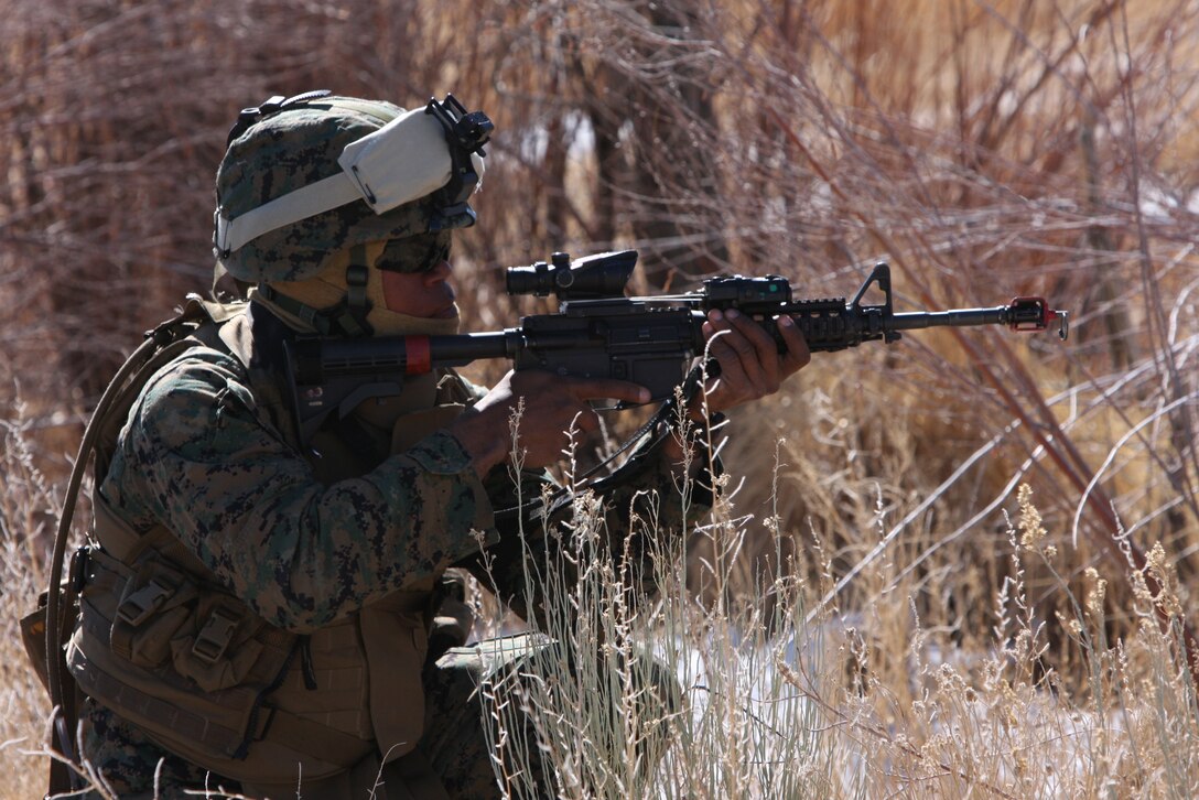 Lance Cpl. Sylvio Francois, an assault guided missileman with Weapons Company, 3rd Battalion, 4th Marine Regiment, sets up security while fellow Marines search the area for notional enemy activity during a convoy training exercise stretching from Bridgeport, Calif., to Hawthorne Army Ammunition Depot in Hawthorne, Nev., March 7.