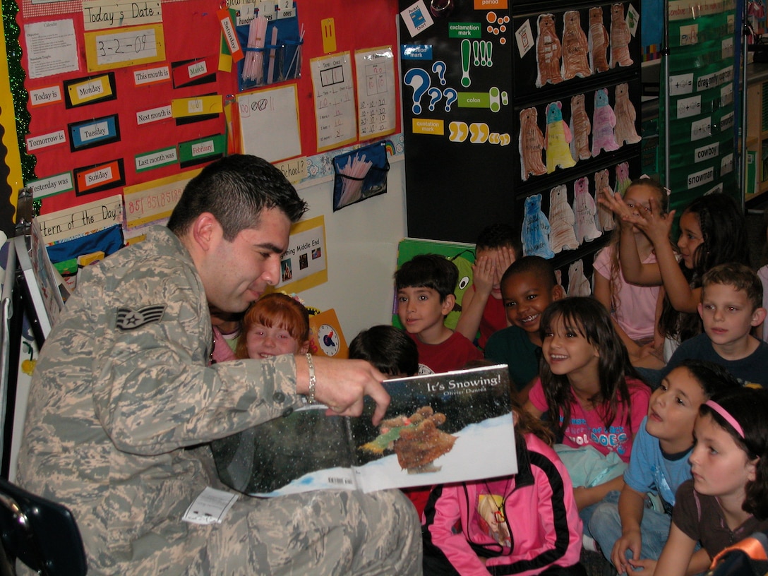 Staff Sgt. Fernando Perez, 452 AMW Public Affairs, reads a winter themed book to first graders at Mark Twain Elementary School in Riverside to celebrate the nationally recognized “Read Across America” program. Volunteers from the base and local community visited elementary schools throughout the local area to encourage children to read. (U.S. Air Force photo by Staff Sgt. Megan Crusher)