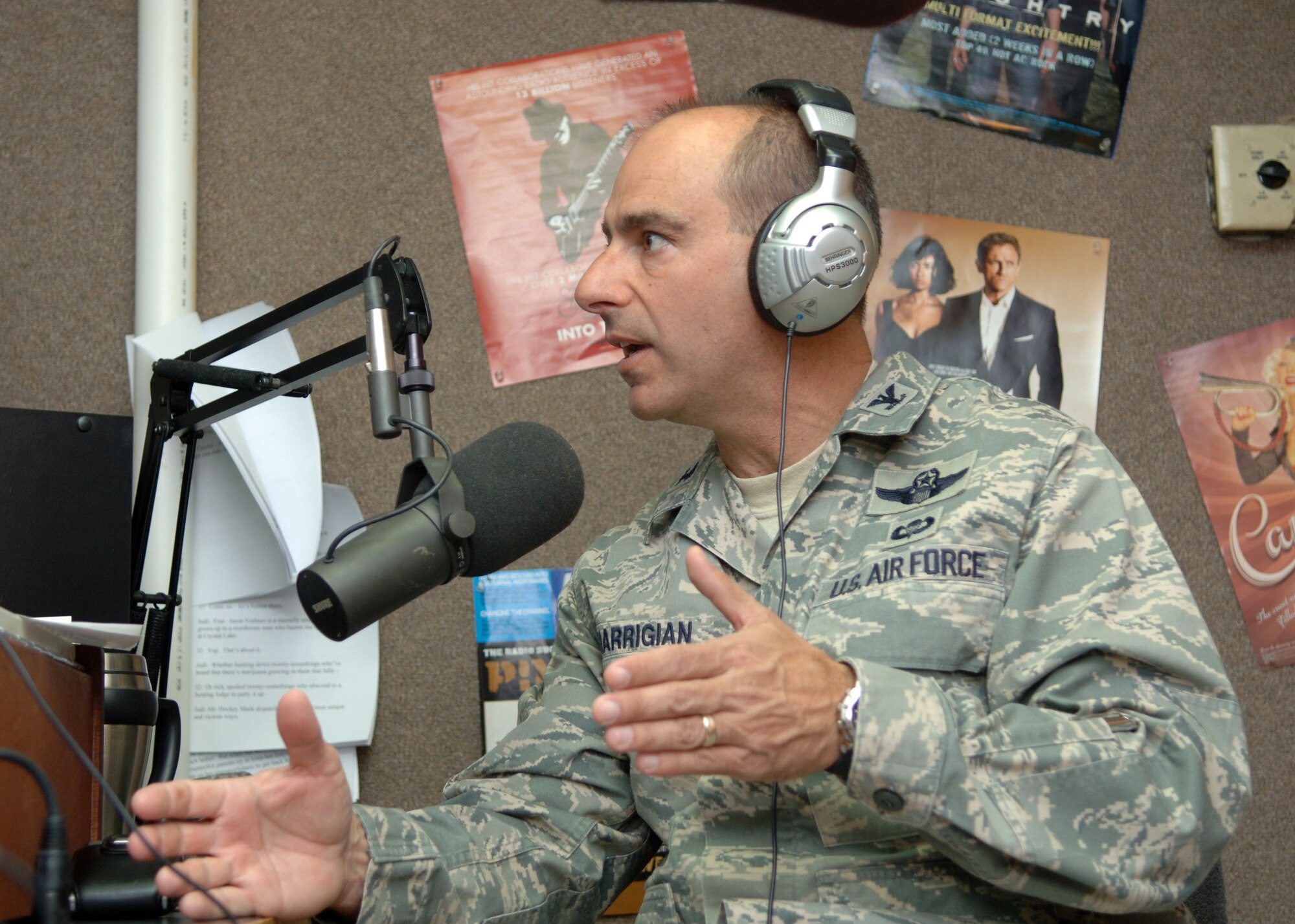 Col. Jeffrey Harrigian, 49th Fighter Wing commander, takes the opportunity to describe to radio personality James "Double J" White the unmanned aerial systems which could be coming to Holloman Air Force Base, N.M. The base has been designated as the preferred location for an additional Unmanned Aircraft System Formal Training Unit. (U.S. Air Force photo/Airman 1st Class Veronica Salgado)