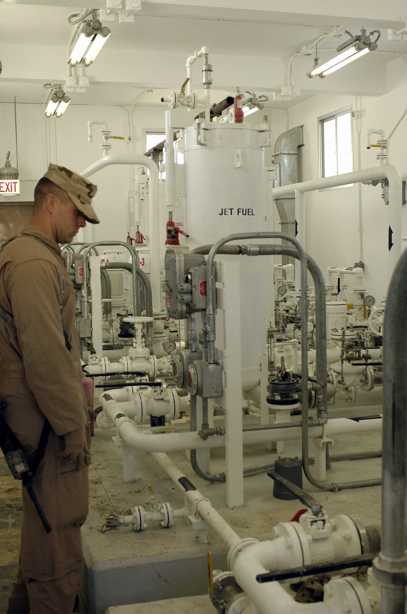 Staff Sgt. Jason King checks valve configurations for a system set up in one of the class III fuels depot pump houses Feb. 17 at Khuja Rawash in Kabul, Afghanistan. Sergeant King is assigned to the 755th Air Expeditionary Group with the Logistics Embedded Training Team of Combined Security Transition Command-Afghanistan. (U.S. Air Force photo/Maj. Carie A. Parker)