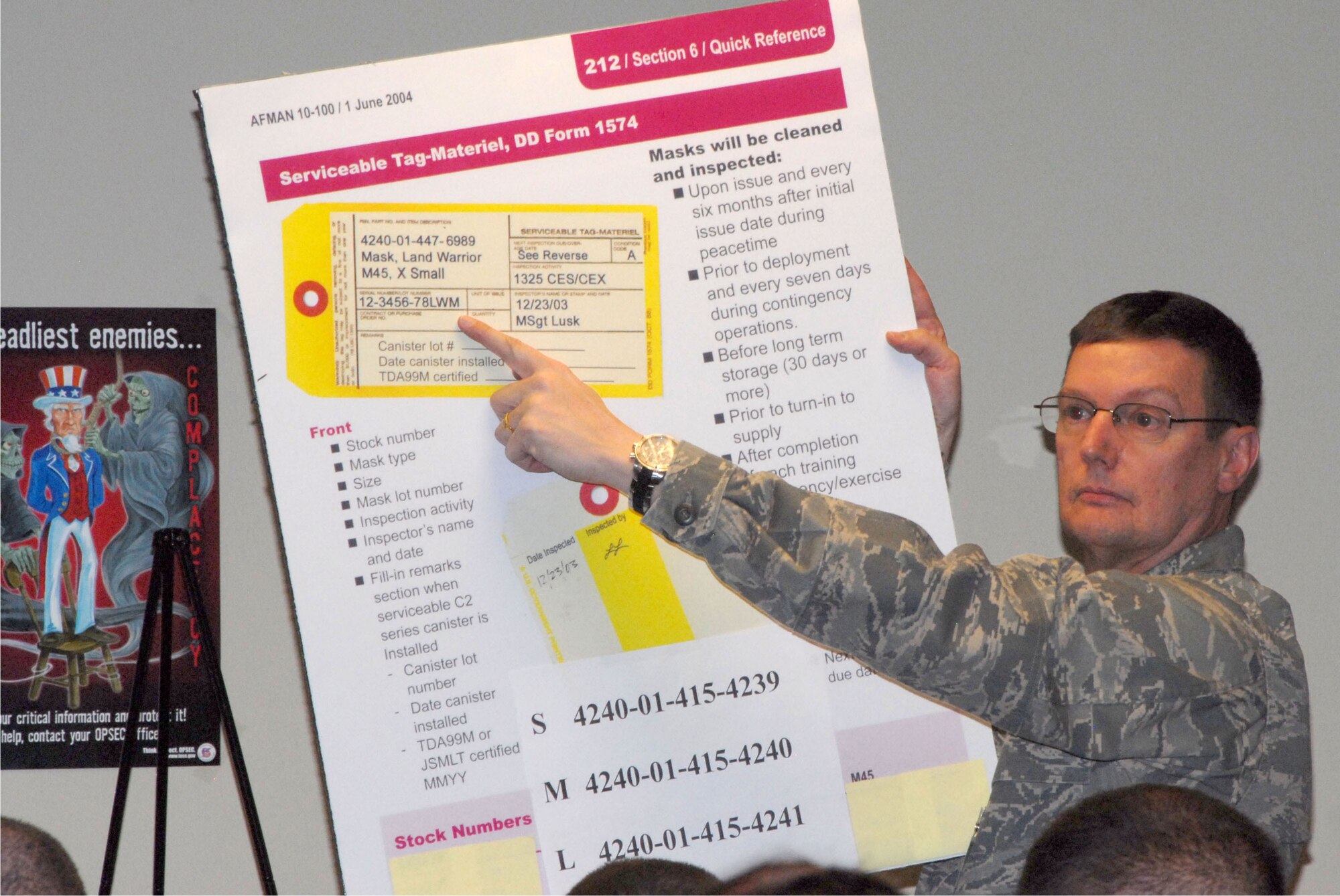 The 140th Wing conducted a Phase 1 Operational Readiness Inspection that required members to process through a deployment line as if they were heading to another country, just like they do in a wartime scenario.  During this phase of the deployment Major Richard Boylan is explaining to member how the DD Form 1574 is filled out so members have the correct information.  (Photo by SrA Carrie Bradley, 140th Public Affairs)