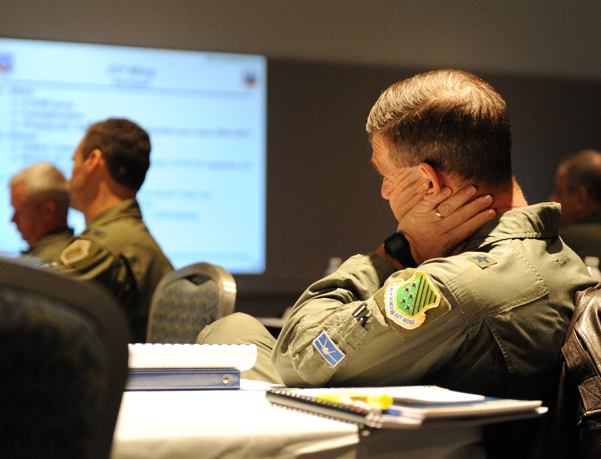 LANGLEY AIR FORCE BASE, Va. – Brig. Gen. Mark A. Barrett, 1st Fighter Wing commander, listens to a briefing conducted during the 9th Air Force Total Force Conference March 4. The conference recognizes the top performers of the 9th AF and provides a time for the commanders of each wing to meet. (U.S. Air Force photo/ Airman 1st Class Zachary Wolf)