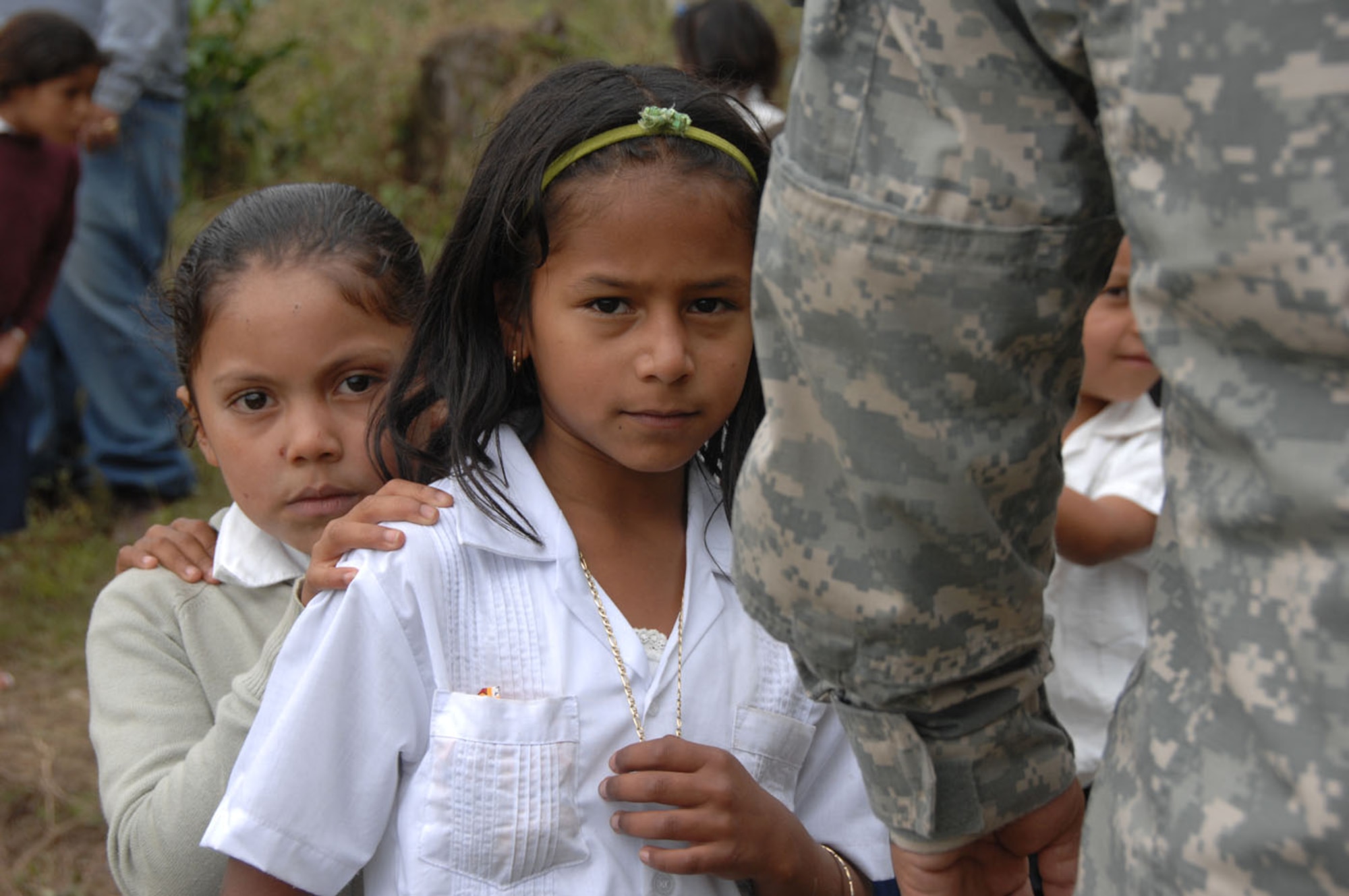 Nearly 350 children from five schools lined up to receive a backpack from the Give a Kid a Backpack Foundation Feb. 24 at Escula Nuevo Mundo in El Encinal, Honduras.  Volunteers from the foundation and Joint Task Force-Bravo worked together to distribute nearly 700 backpacks in two days.  (U.S. Army photo/Specialist Christopher Wellner)