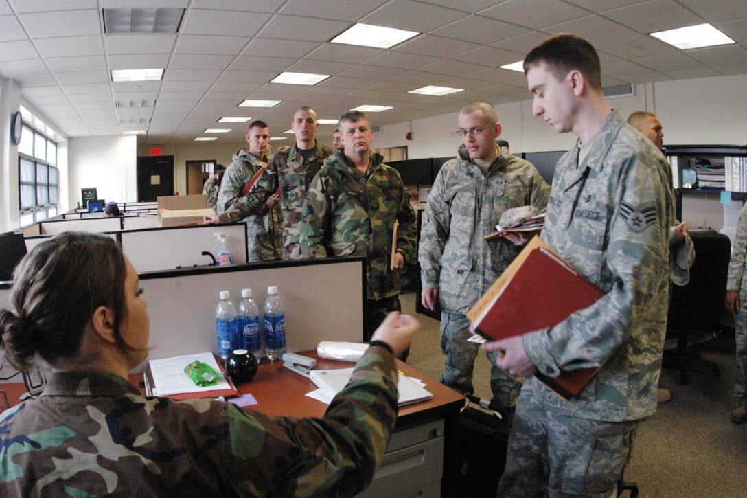 A group of 89 AW members are outprocessed through the mobilization line at the Installation Deployment Readiness Cell, located in the Community Activity Center Feb. 27. (U.S. Air Force photo/ Bobby Jones)