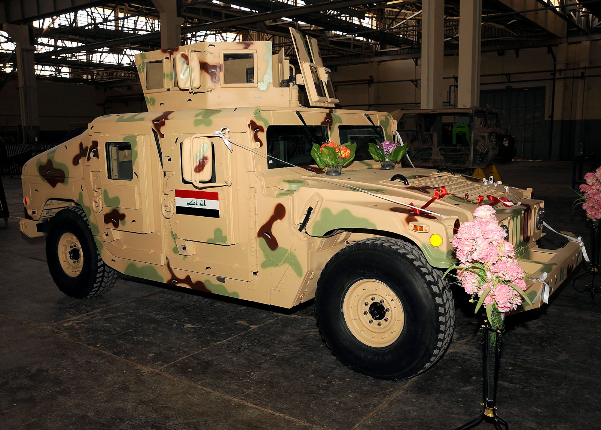 An M1114 HMMWV is called Project One because it is the first vehicle to go through the overhaul production by an all Iraqi maintenance crew March 4 at Taji, Iraq. Members of the Iraqi army worked on the transmission, engine, drive train and paint job. (U.S. Air Force photo/Senior Airman Jacqueline Romero) 
