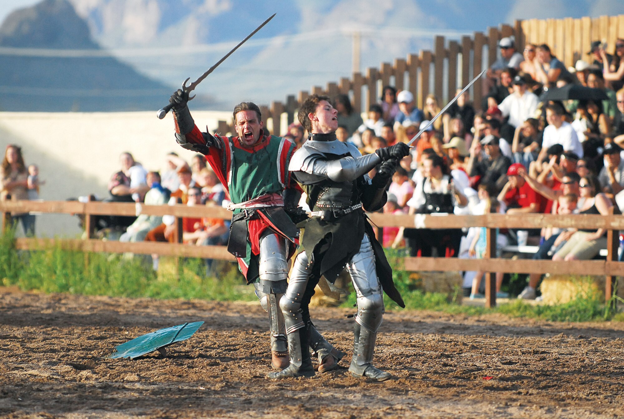 Knights fight to the “death” after being knocked from their horses during the final festival joust. The final joust is overseen by the King and Queen of the festival, as well as the Arch Bishop. (U.S. Air Force photo/ C.J. Hatch.)