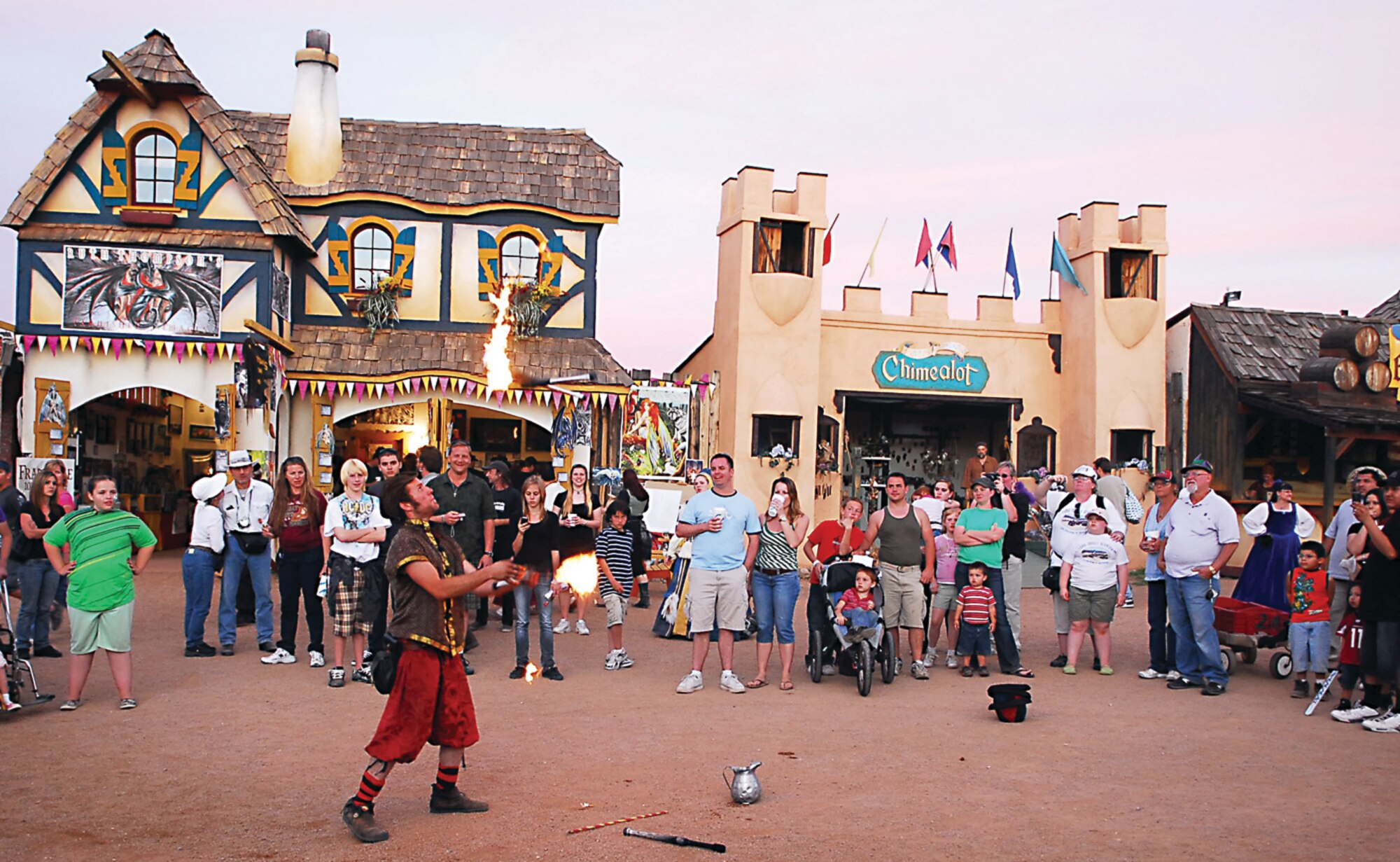 People stop to watch one of the many street performers juggle fire torches during the Arizona Renaissance Festival. The festival has acts including comedy, a falconer’s show, mud show and jousting. The festival is open Saturdays and Sundays through March 29 at 12601 East Highway 60, Apache Junction, Ariz. Outdoor recreation is hosting a trip to the festival  March 21. Register by March 13 by calling (623) 856-9334. (U.S. Air Force photo/ C.J. Hatch.)