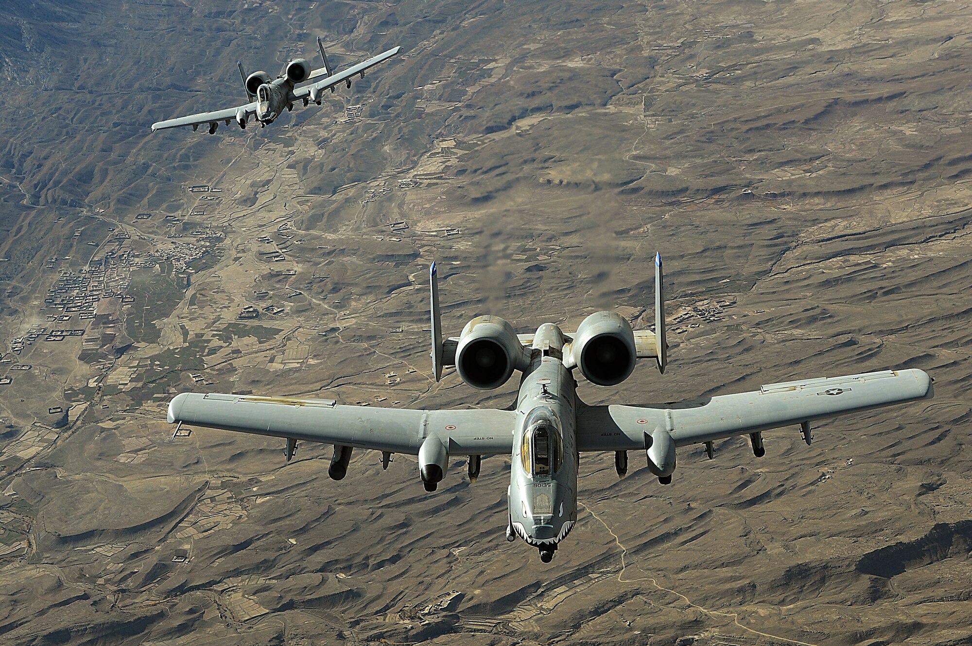 Two A-10 Thunderbolt IIs in-flight over Afghanistan providing aerial security for coalition forces. A-10s perform shows of force to deter enemy activities and provide close-air support to coalition forces in Southwest Asia. (U.S. Air Force photo/Staff Sgt. Aaron Allmon)