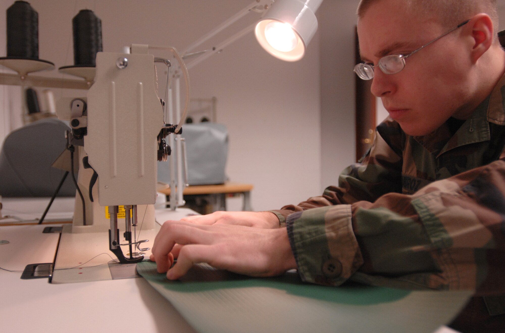 Airman 1st Class Maxximilia Quiroz sews a foreign object debris bag March 3 at the life support shop.  The life-support unit here ensures all aircrews receive the best life-support equipment for flights and emergency situations. Typical survival equipment includes water, food rations, fishing kits, flares, radio, compass, mirror, glow sticks and fire starters. Airman Quiroz is assigned to the 31st Operations Support Squadron.  The wing mission here is to conduct and support air operations in Europe's southern region and to maintain munitions for the North Atlantic Treaty Organization.  (U.S. Air Force photo/Airman 1st Class Tabitha M. Mans)