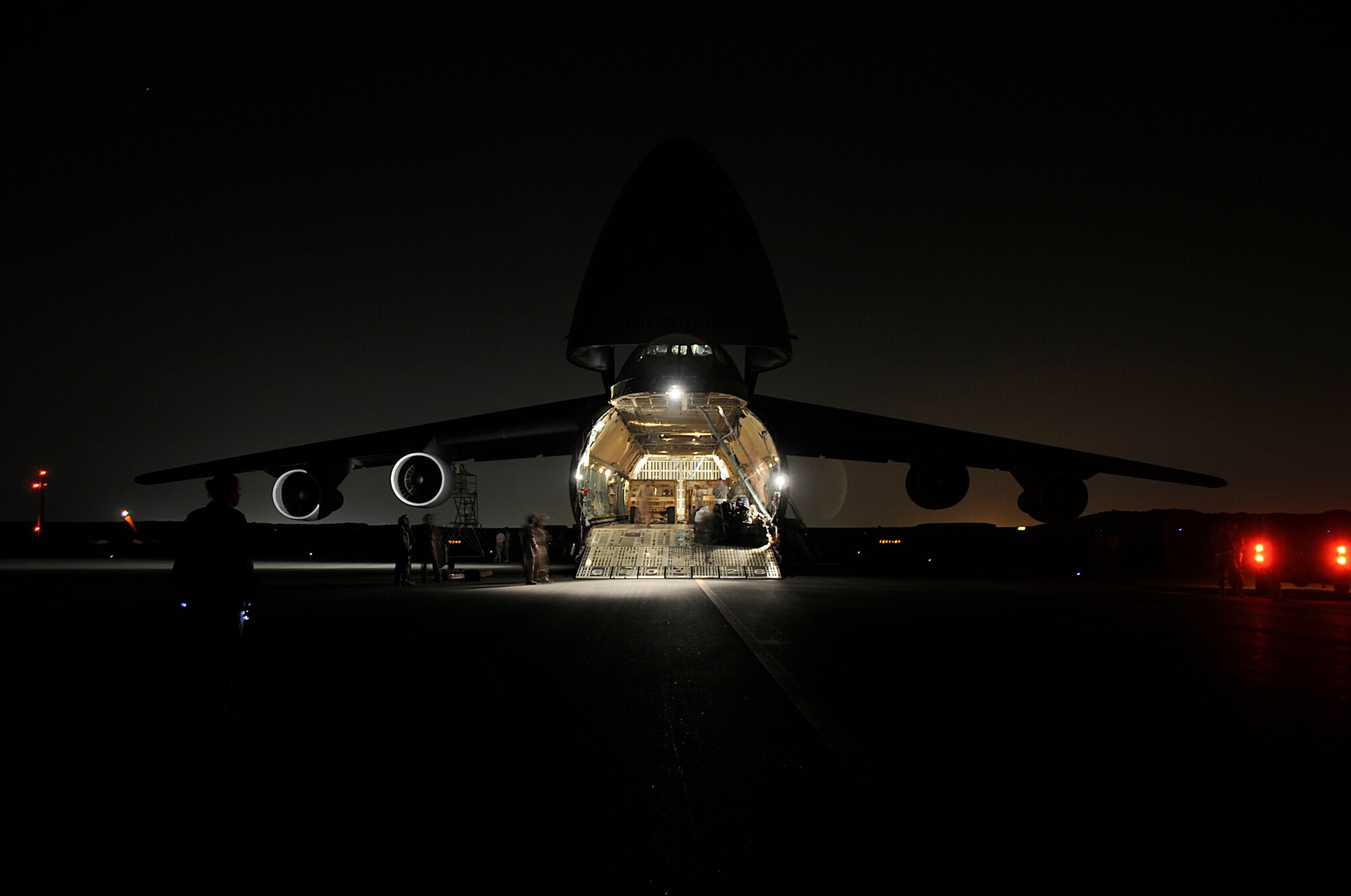 SOUTHWEST ASIA - A high mobility multipurpose vehicle (Humvee) is off-loaded from a C-5 Galaxy at the 380th Air Expeditionary Wing, Mar 6. Vehicles and equipment belonging to the 5-52 Air Defense Artillery Battalion were unloaded as part of the first Patriot Battery mission for the wing, improving air defense capability. The Army will be incorporated into the 380th AEW's mission in support of Operations Iraqi and Enduring Freedom and Joint Task Force Horn of Africa. The 5-52 Air Defense Artillery Battalion is deployed out of Fort Bliss, TX. (U.S. Air Force photo by Senior Airman Brian J. Ellis) (Released)