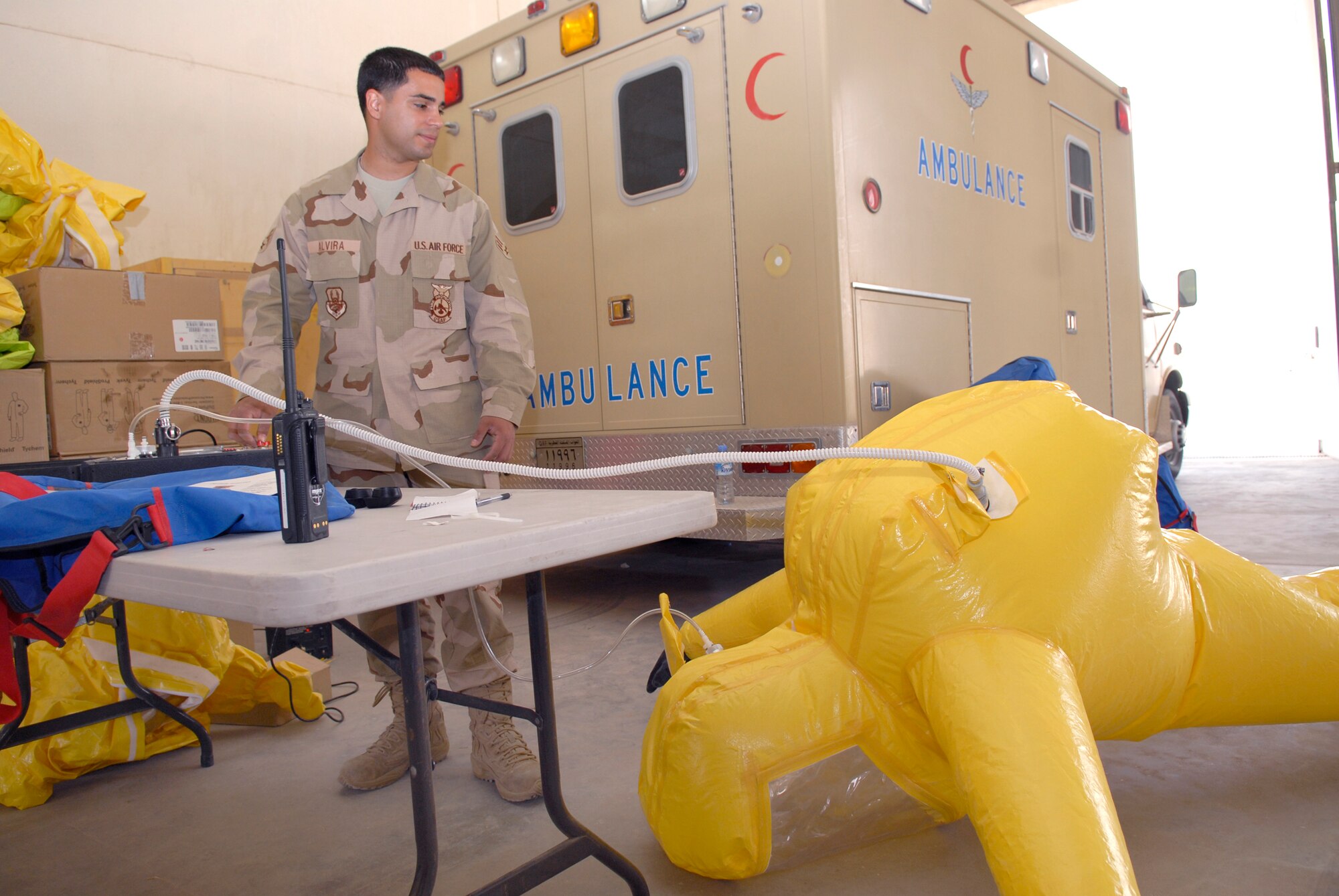Senior Airman Jorge Alvira, a 379th Expeditionary Civil Engineer Squadron Firefighter, checks the hazardous materials suit for tears or leaks to ensure the safety of the firefighters who wear them, Mar. 5, 2009, at an undisclosed location in Southwest Asia.  Airman Alvira hails from Bronx, N.Y. and is deployed from McGuire Air Force Base, N.J. in support of Operations Iraqi and Enduring Freedom and Combined Joint Task Force - Horn of Africa.  (U.S. Air Force Photo by Senior Airman Andrew Satran/Released)