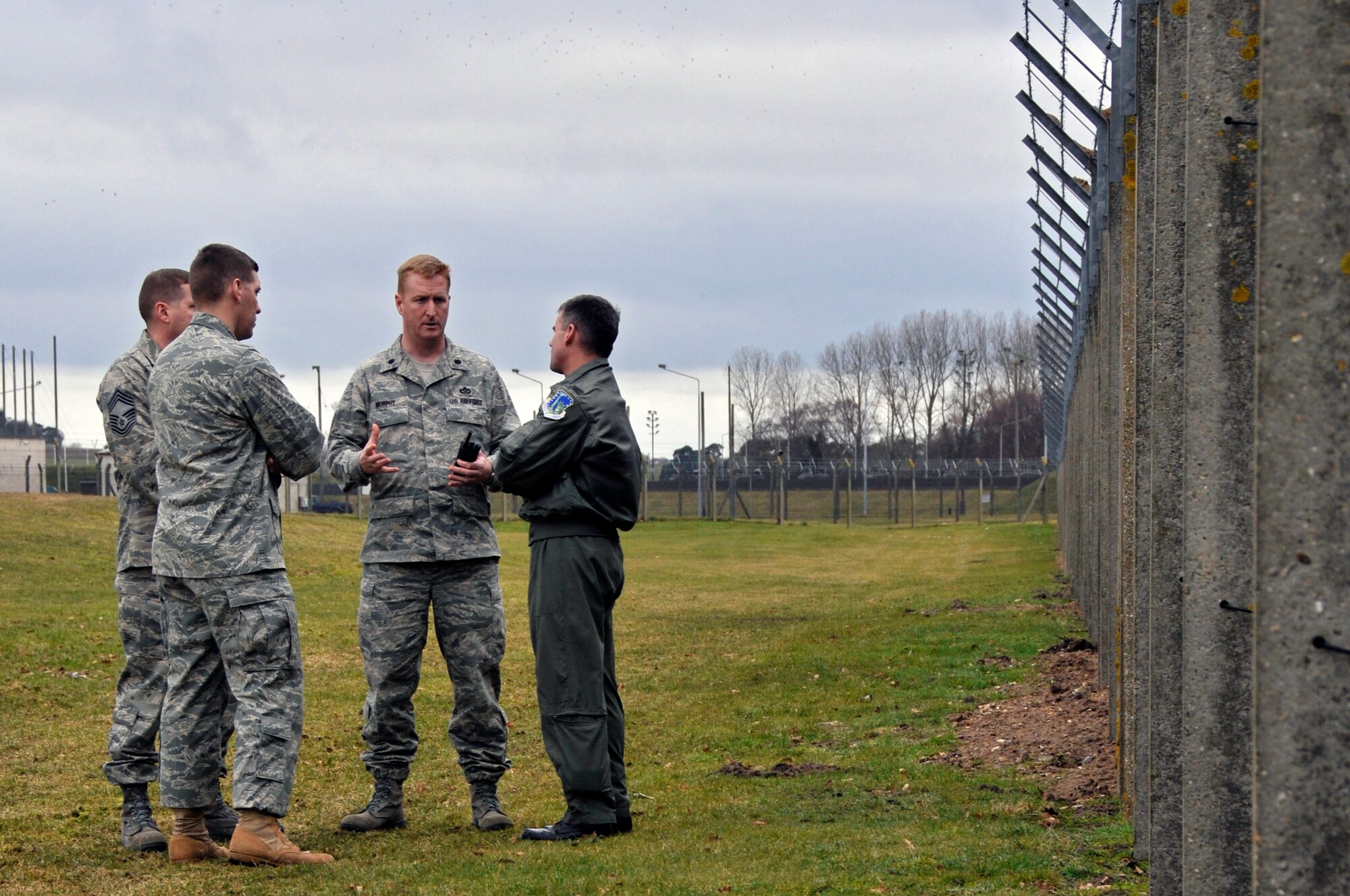 Col. Jay Silveria 48th Fighter Wing Commander, Lt. Col. Brian Murphy 48th Mission Support Group deputy commander, Capt. Ian Walker 48th Security Forces acting commander, and Chief Master Sgt. Eric Welsh 48th Security Forces Manager, discuss the potential issues with wildlife and the perimeter fence Feb. 18, 2009 at RAF Lakenheath, England. Col. Silveria traveled along the entire perimeter of the base. (U.S. Air Force photo by Airman 1st Class Perry Aston)