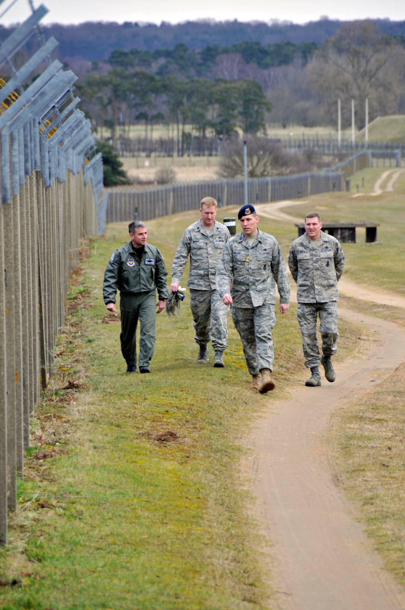 Col. Jay Silveria 48th Fighter Wing Commander, Lt. Col. Brian Murphy 48th Mission Support Group deputy commander, Capt. Ian Walker 48th Security Forces acting commander and Chief Master Sgt. Eric Welsh 48th Security Forces Manager, discuss the potential issues with wildlife and the perimeter fence Feb. 18, 2009 at RAF Lakenheath, England. Col. Silveria traveled along the entire perimeter of the base. (U.S. Air Force photo by Airman 1st Class Perry Aston)