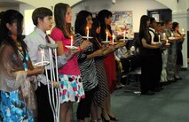 ANDERSEN AIR FORCE BASE, Guam - Andersen Middle School officials induct 12 students into the National Junior Honor Society here March 6. The National Junior Honor Society was established to recognize outstanding middle school students. More than just an honor roll, NJHS serves to honor those students who have demonstrated excellence in the areas of scholarship, leadership, citizenship, service and character. (U.S. Air Force photo by Airman 1st Class Courtney Witt)