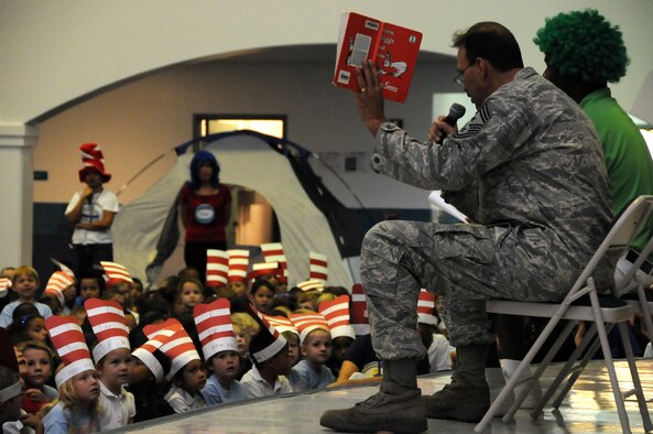 ANDERSEN AIR FORCE BASE, Guam - The 36th Wing Command Chief Bud Andree reads "Green Eggs and Ham" to Andersen Elementary students during the Dr. Seuss Book Camp here March 6. The children have read many books written by Dr. Seuss throughout the week with mixtures of worksheets, puzzles and coloring sheets to familiarize themselves with the creative writer himself. (U.S. Air Force photo by Airman 1st Class Courtney Witt)
