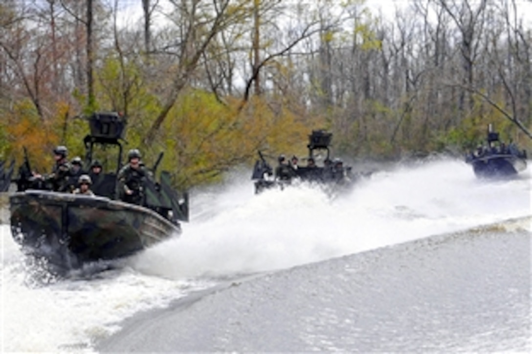 U.S. Navy Special Warfare Combatant-craft crewmen assigned to Special Boat Team 22 conduct live-fire drills on the riverine training range at John C. Stennis Space Center, Miss., March 4, 2009. The unit operates the special operations craft-riverine and is the only U.S. special operations command dedicated to operating in the riverine environment.