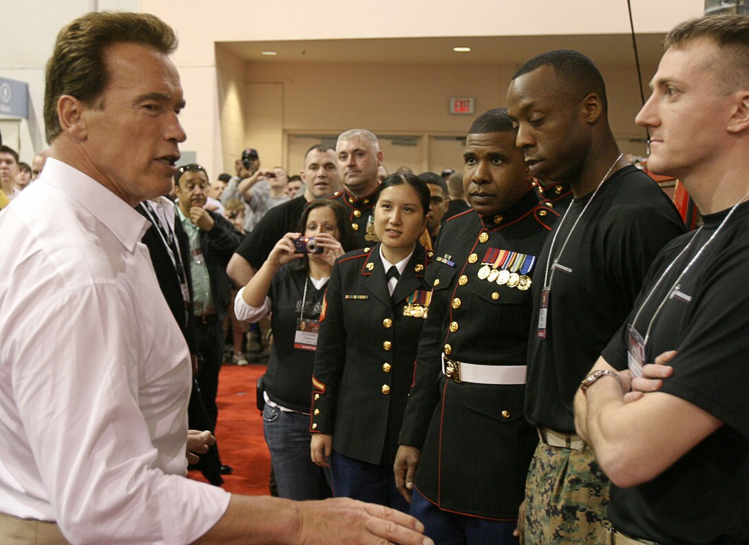 California Gov. Arnold Schwarzenegger speaks with Lt. Hudson Reynolds and other Marines of the 4th Marine Corps District at the 2009 Arnold Sports Festival Mar. 7. This three-day event is now the world’s largest multi-sport fitness weekend.