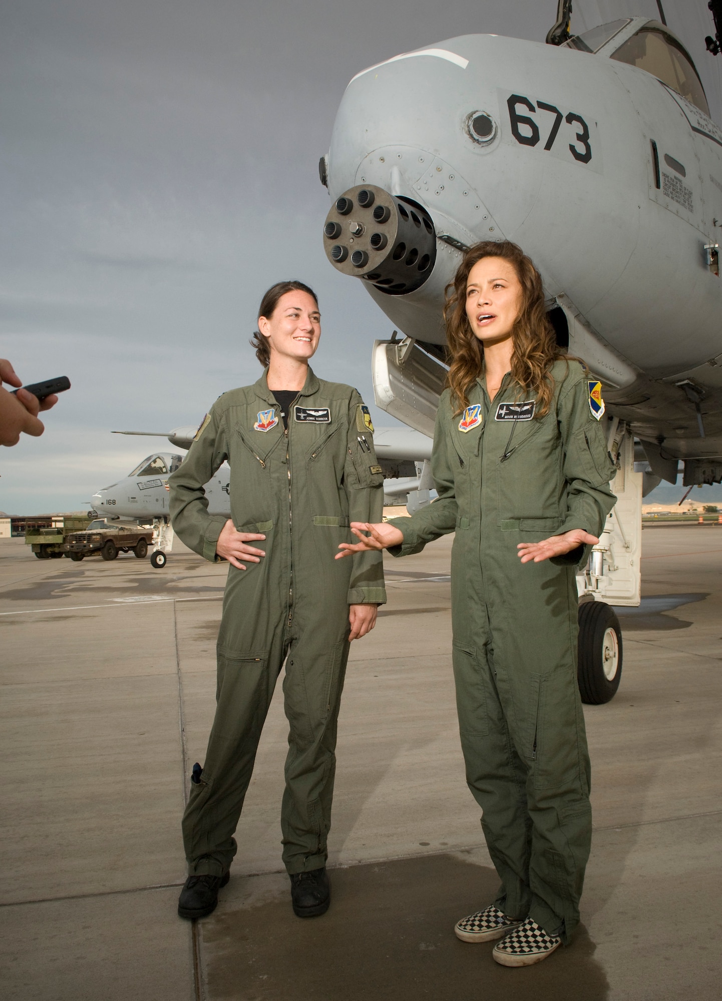 Capt. Jennie Schoeck and actress Moon Bloodgood met in front of an  A-10 fighter for an interview with the news media, during the production of Terminator Salvation at Kirtland Air Force Base, NM on July 18, 2008.  Capt. Schoeck is assigned to the 358 Fighter Squadron, Davis-Monthan Air Force Base, AZ was the A-10 fighter advisor for the production. Moon Bloodgood portrays a lead resistance pilot in the movie. The 358th Fighter Squadron is the Air Force's only active-duty A/OA-10A formal training unit the 358th FS conducts all formal course directed aircraft transition, day/night weapons and tactics employment, day/night air refueling, air combat and dissimilar air combat maneuver training for pilot initial qualification, requalification and instructor qualification in the A-10A for the Combat Air Forces.  (U.S. Air Force photo/Lance Cheung