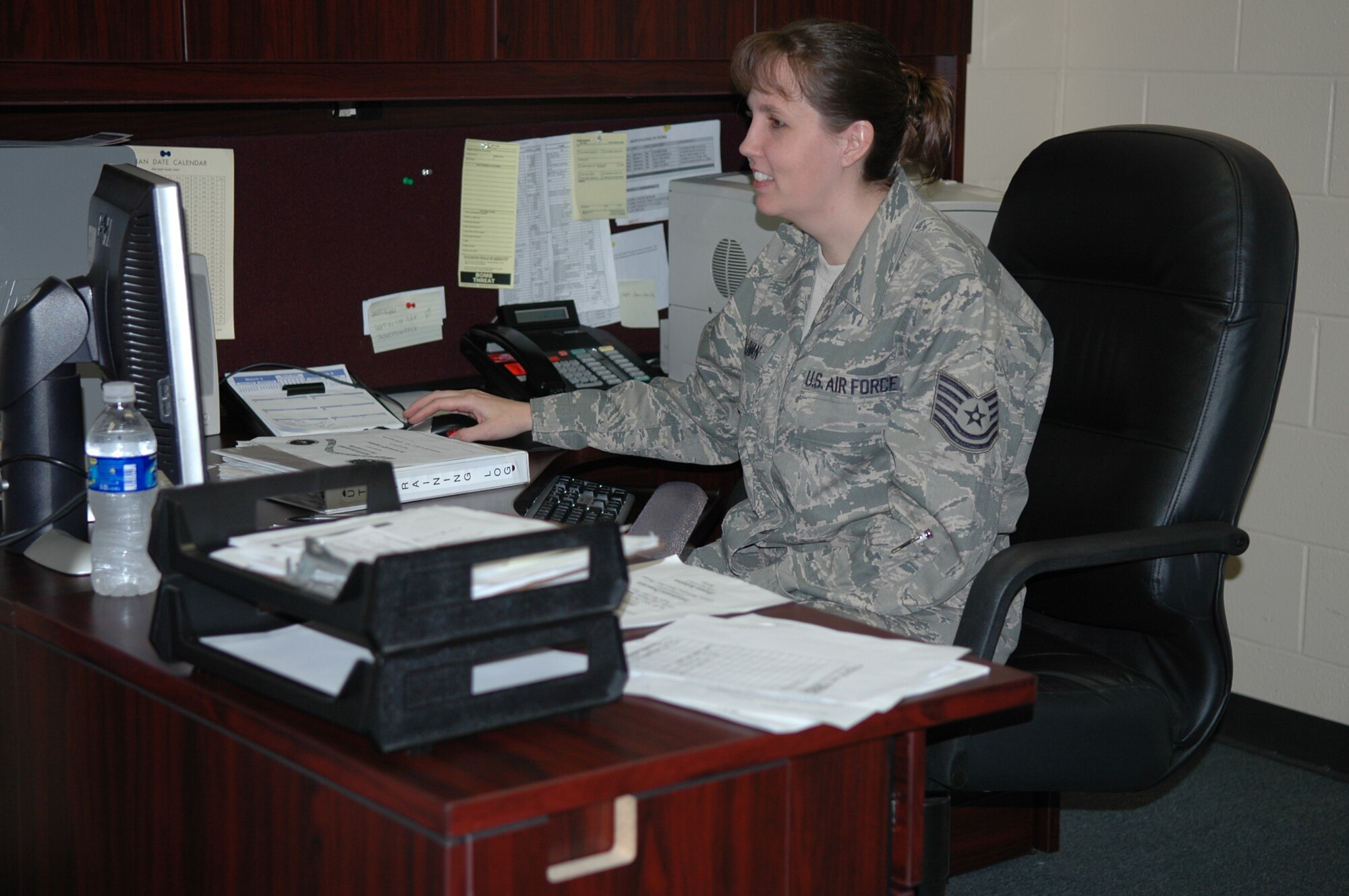 The 917th Wing Noncommissioned Officer of the Quarter for January - March 2009, Technical Sgt. Julie Sullivan, Senior Airman Bobby Trichel, 917th Maintenance Squadron, updates training records on Mar. 7 at Barksdale AFB, La. (U.S. Air Force Photo/Staff Sgt. Ebony Nichols)