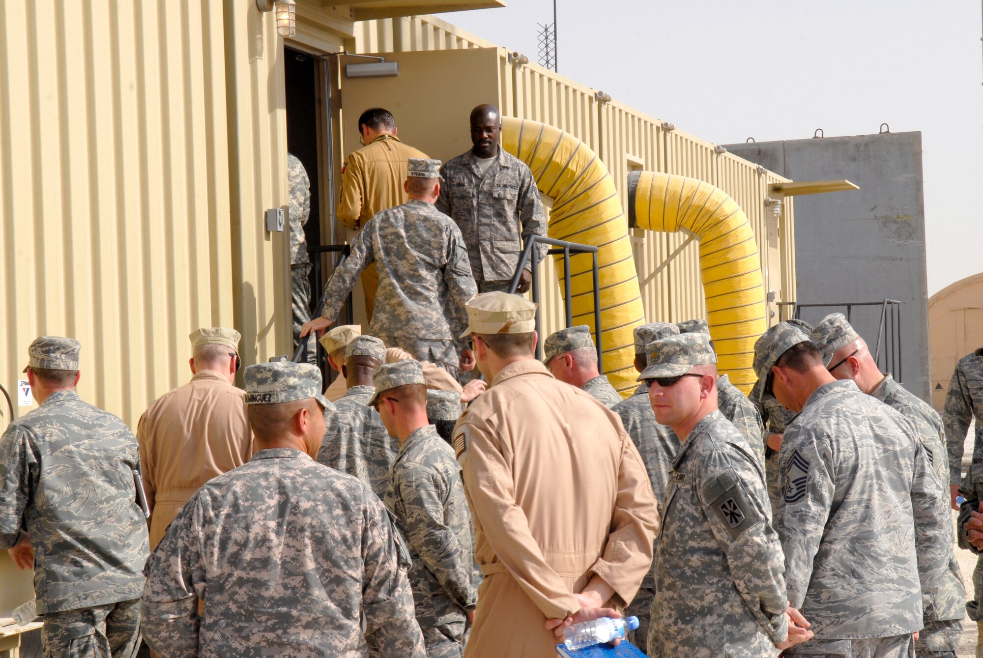 U.S. and coalition forces enter the new Battlespace Command and Control Center during its opening Feb. 26, 2009, at an undisclosed location in Southwest Asia in support of Operations Iraqi and Enduring Freedom and Combined Joint Task Force - Horn of Africa.  (U.S. Air Force Photo by Airman 1st Class Andrew Satran) 