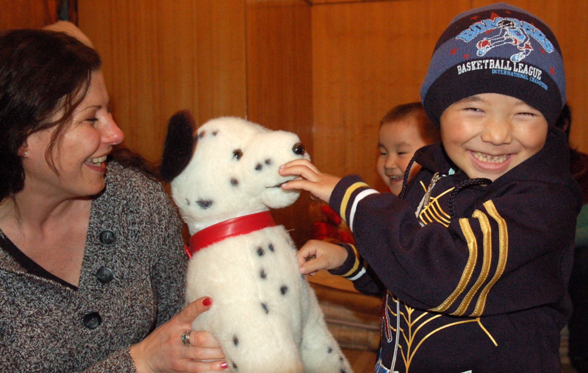 Tech. Sgt. Phyllis Hanson gives a stuffed toy to a recovering patient during a visit March 4 to the Children's Heart Hospital in Bishkek, Kyrgyzstan. During the visit, Sergeant Hanson and other Manas Air Base Outreach Society members spent off-duty time with children who have congenital heart defects and require life-saving surgeries. MABOS also donated approximately $4,500 to the hospital to pay for eight heart surgeries in addition to the 129 funded since 2003. Sergeant Hanson is assigned the 376th Air Expeditionary Wing Public Affairs and is deployed from Air Education and Training Command Public Affairs at Randolph Air Force Base, Texas. She is originally from Soldier, Iowa. (U.S. Air Force photo/Maj. Damien Pickart)