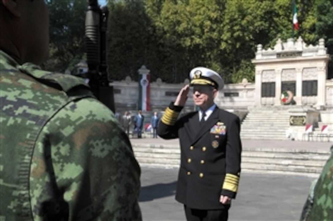 Chairman of the Joint Chiefs of Staff U.S. Navy Adm. Mike Mullen salutes Mexican army soldiers at Chapultepec Park in Mexico City, Mexico, March 6, 2009. The chairman laid a wreath at the 201st Fighter Squadron memorial and talked with former squadron members, who deployed with U.S. forces to the Philippines during World War II. 