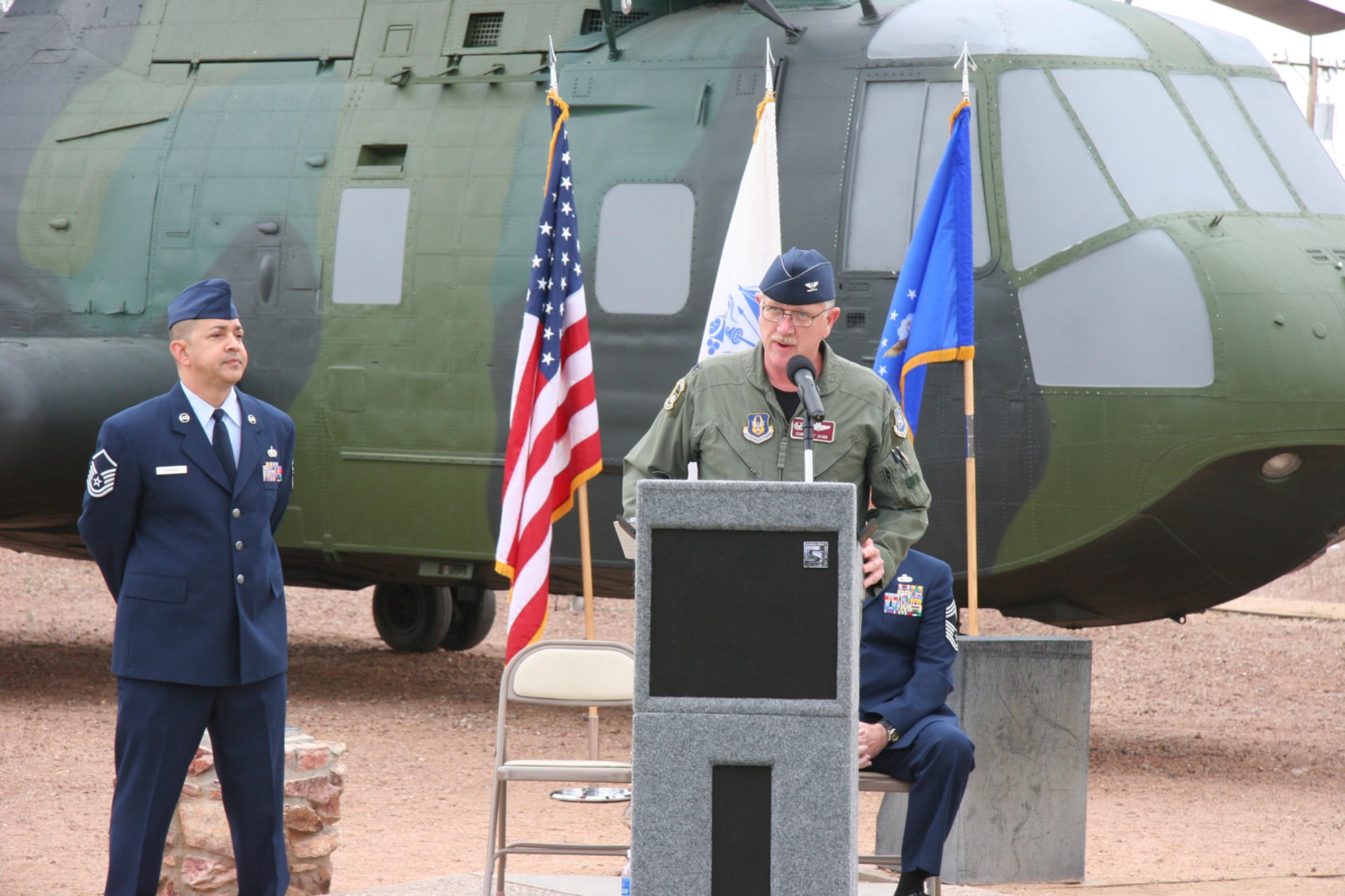 DAVIS-MONTHAN AIR FORCE BASE, Ariz. -- Col. Robert L. Dunn, commander of the Air Force Reserve's 943rd Rescue Group, addresses the audience at a memorial service in honor of the crew and passengers of PONY 1-2 who perished in a helicopter crash March 12, 1989. U.S. Air Force photo/Master Sgt. Ruby Zarzyczny