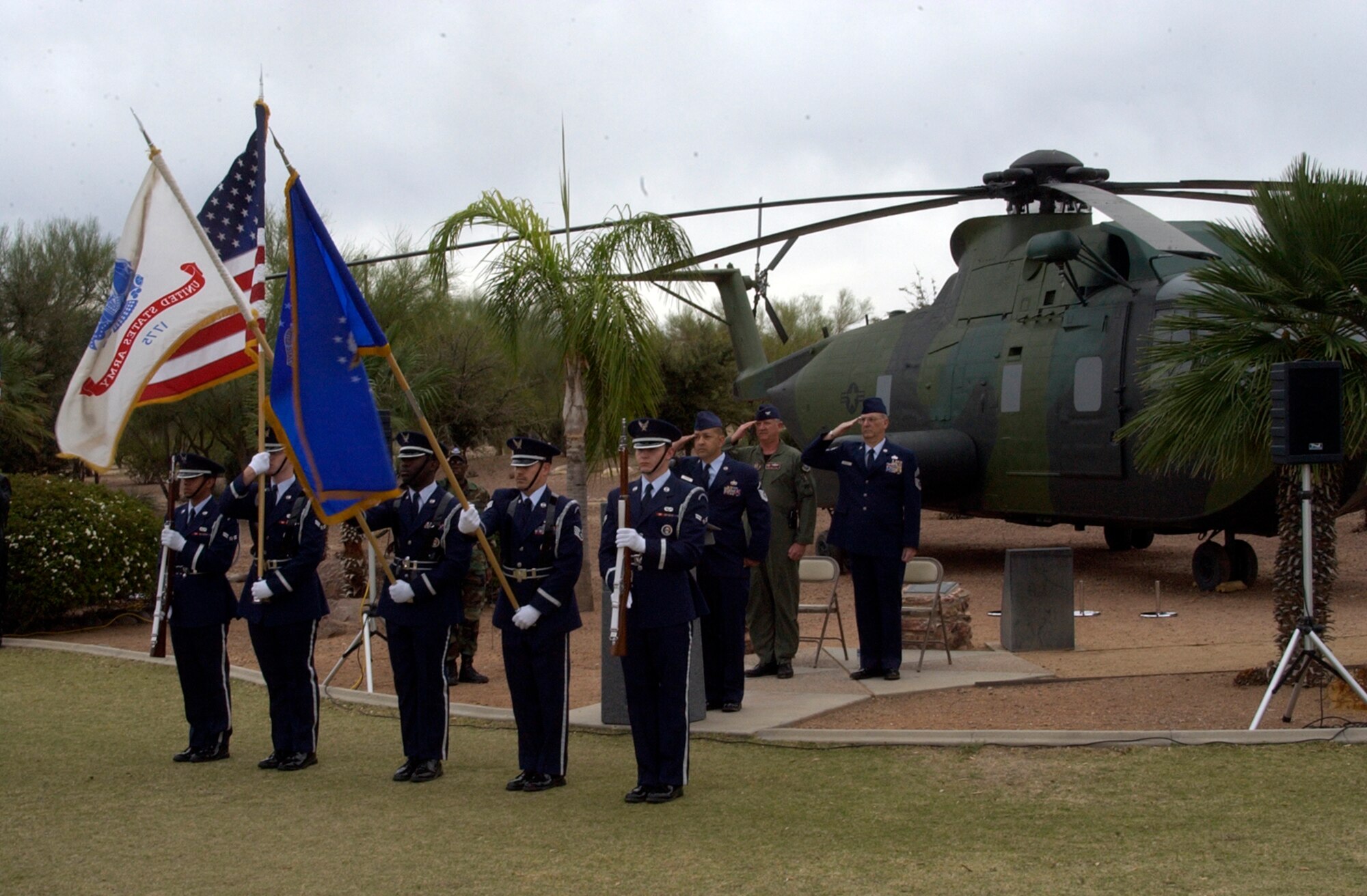 DAVIS-MONTHAN AIR FORCE BASE, Ariz. -- The Davis-Monthan Air Force Base Honor Guard posts the Colors at a memorial ceremony in honor of the 15 men who died in the crash of PONY 1-2 March 12, 1989. The event was held at a static display model of the helicopter at Heritage Park here. U.S. Air Force photo/Master Sgt. Bryan Ripple